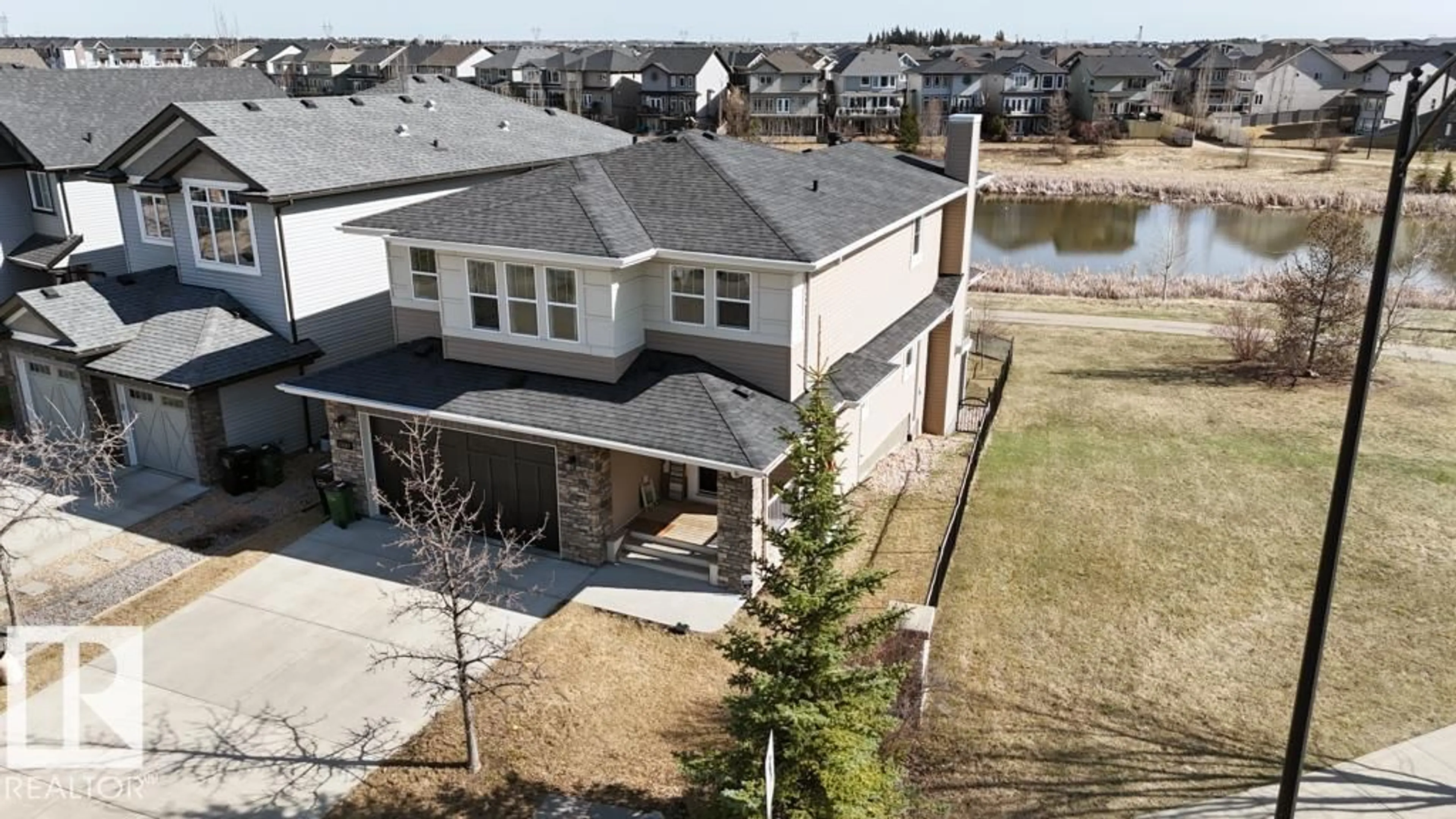 A pic from outside/outdoor area/front of a property/back of a property/a pic from drone, water/lake/river/ocean view for SW - 15867 11 AV, Edmonton Alberta T6W2H3