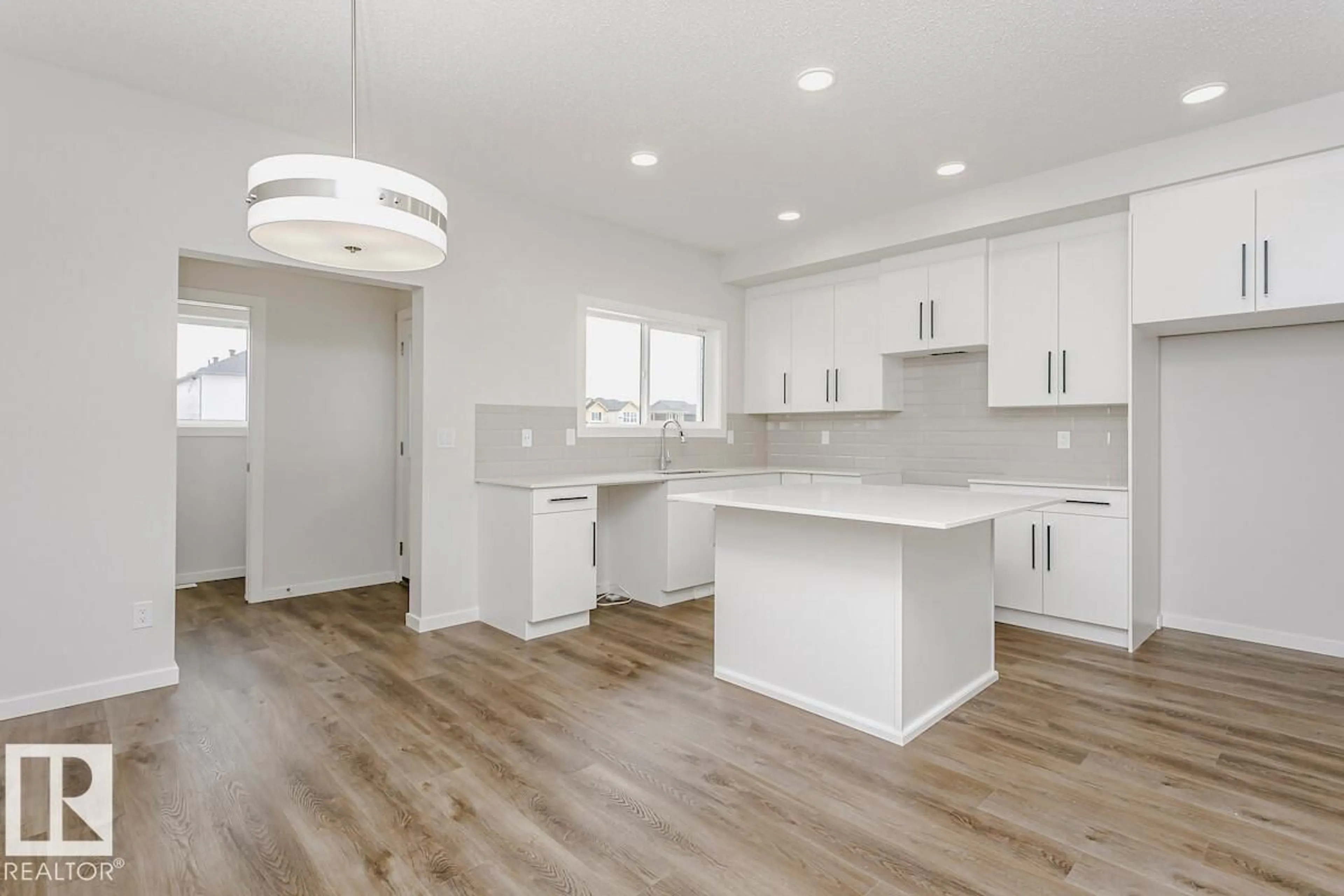 Open concept kitchen, wood/laminate floor for 18109 73A ST, Edmonton Alberta T5Z0J1