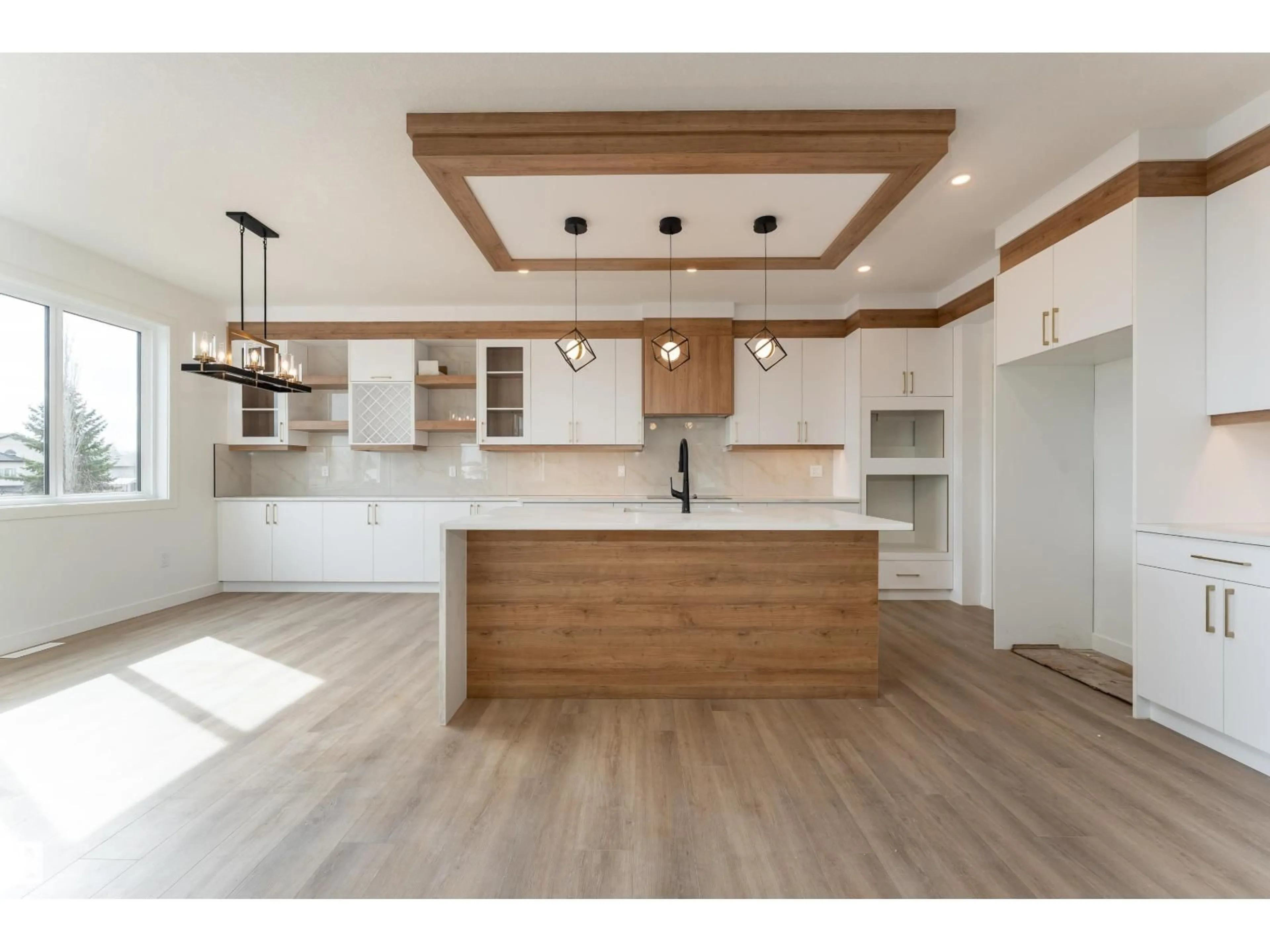 Open concept kitchen, wood/laminate floor for 3833 52 ST, Gibbons Alberta T0A1N0