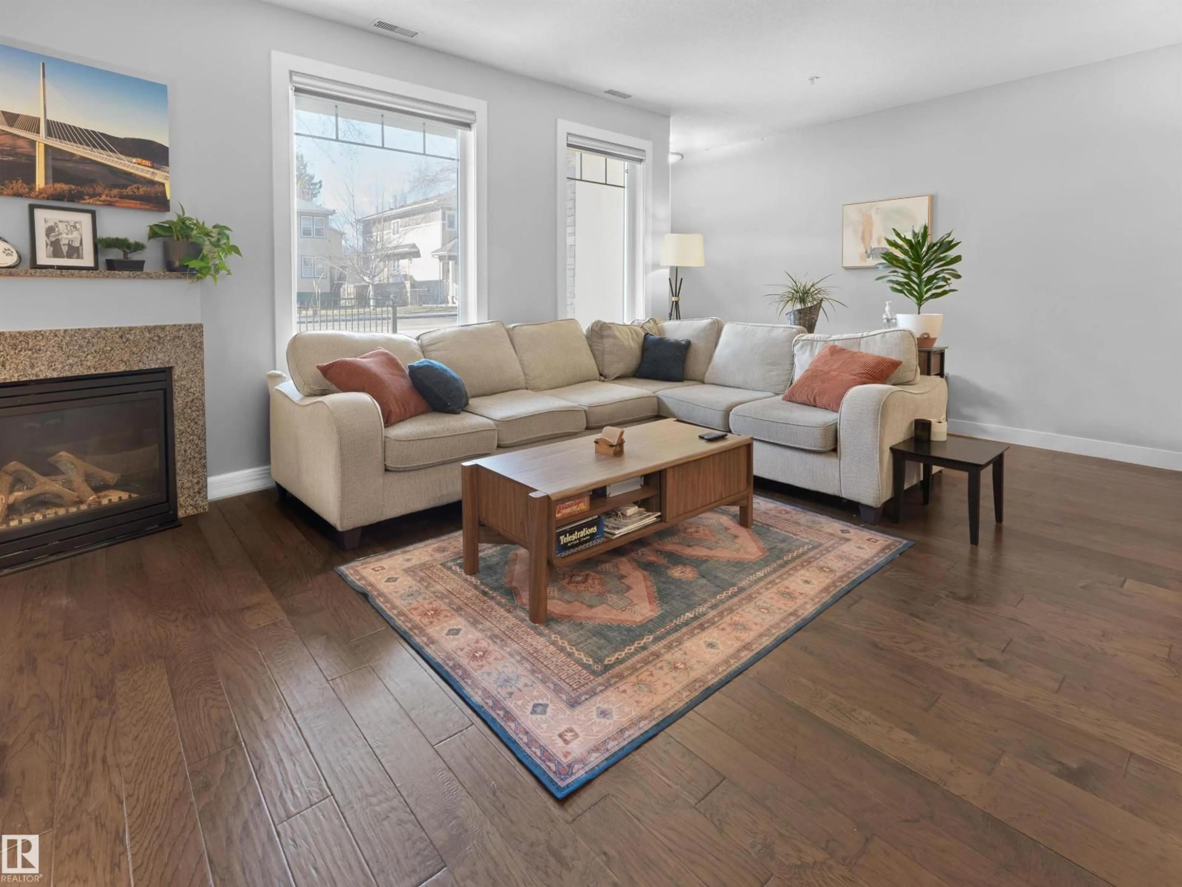 Living room with furniture, wood/laminate floor for 13 - 11518 76 AV, Edmonton Alberta T6G0K7