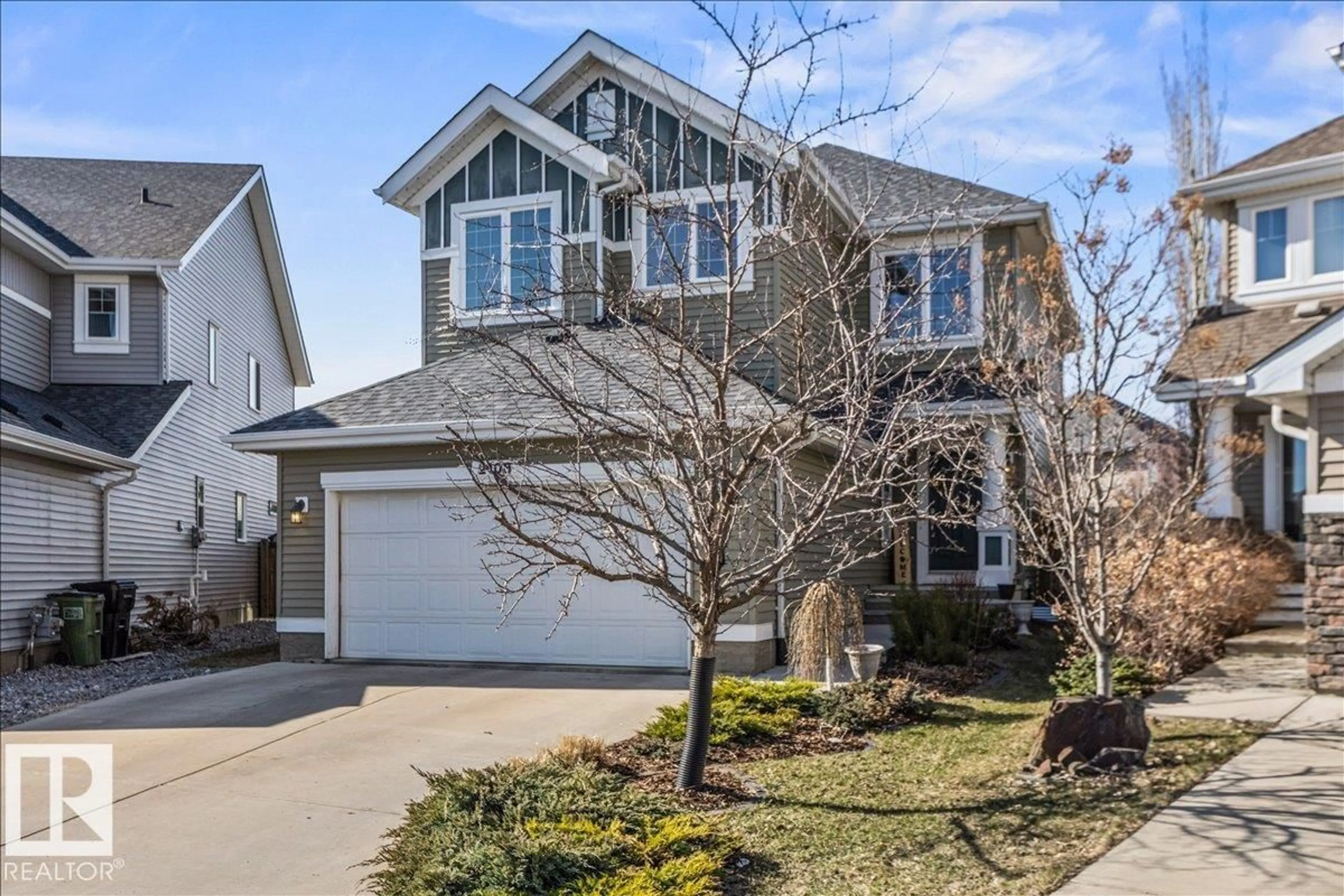 Home with vinyl exterior material, street for SW - 2108 77 ST, Edmonton Alberta T6X0Z3