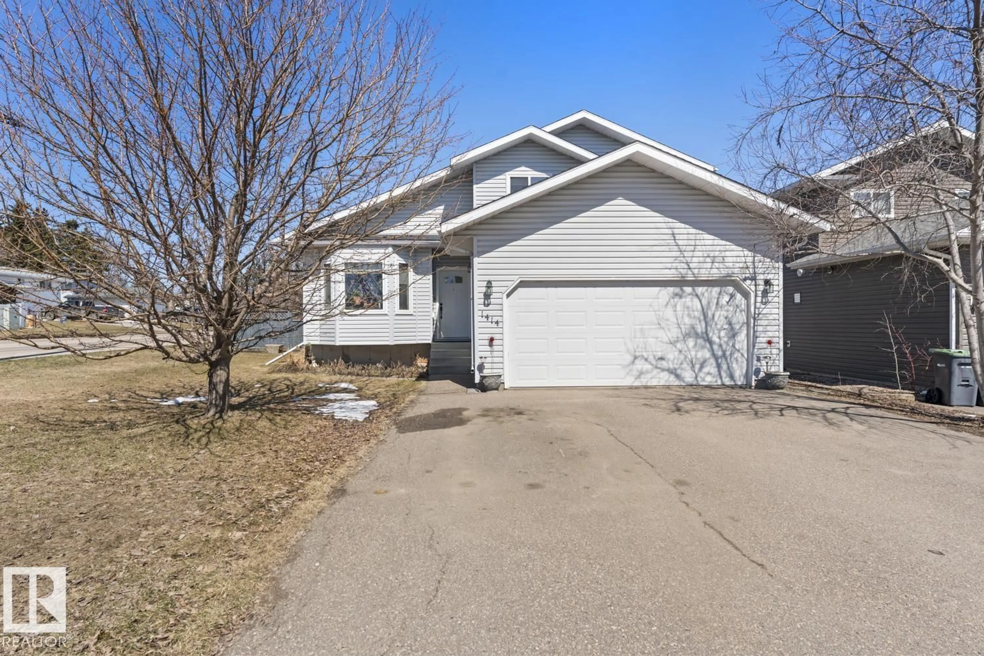 Home with vinyl exterior material, street for 1414 7 AV, Cold Lake Alberta T9M1B4
