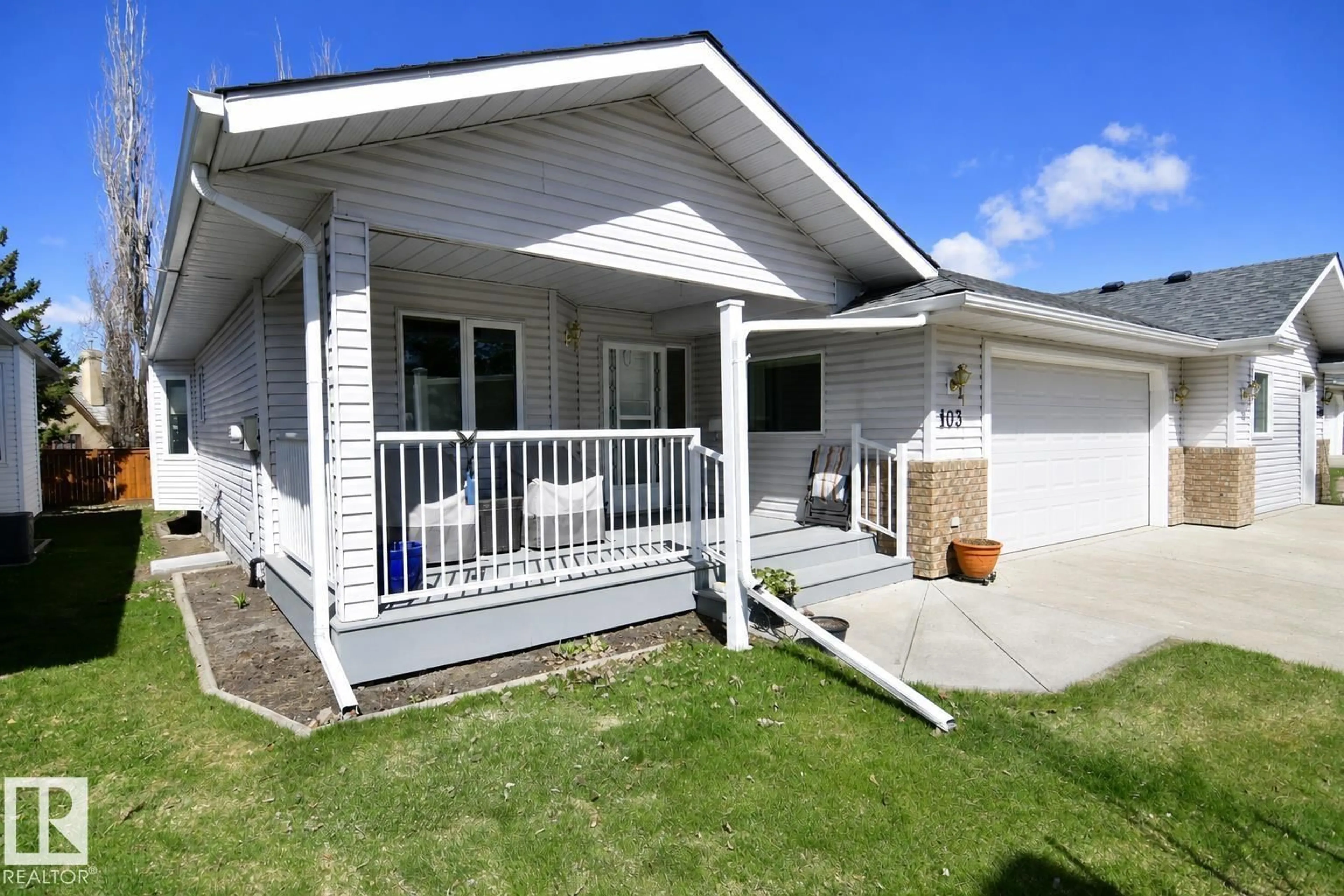 Home with vinyl exterior material, street for 103 LAKESIDE PL, Leduc Alberta T9E6P3