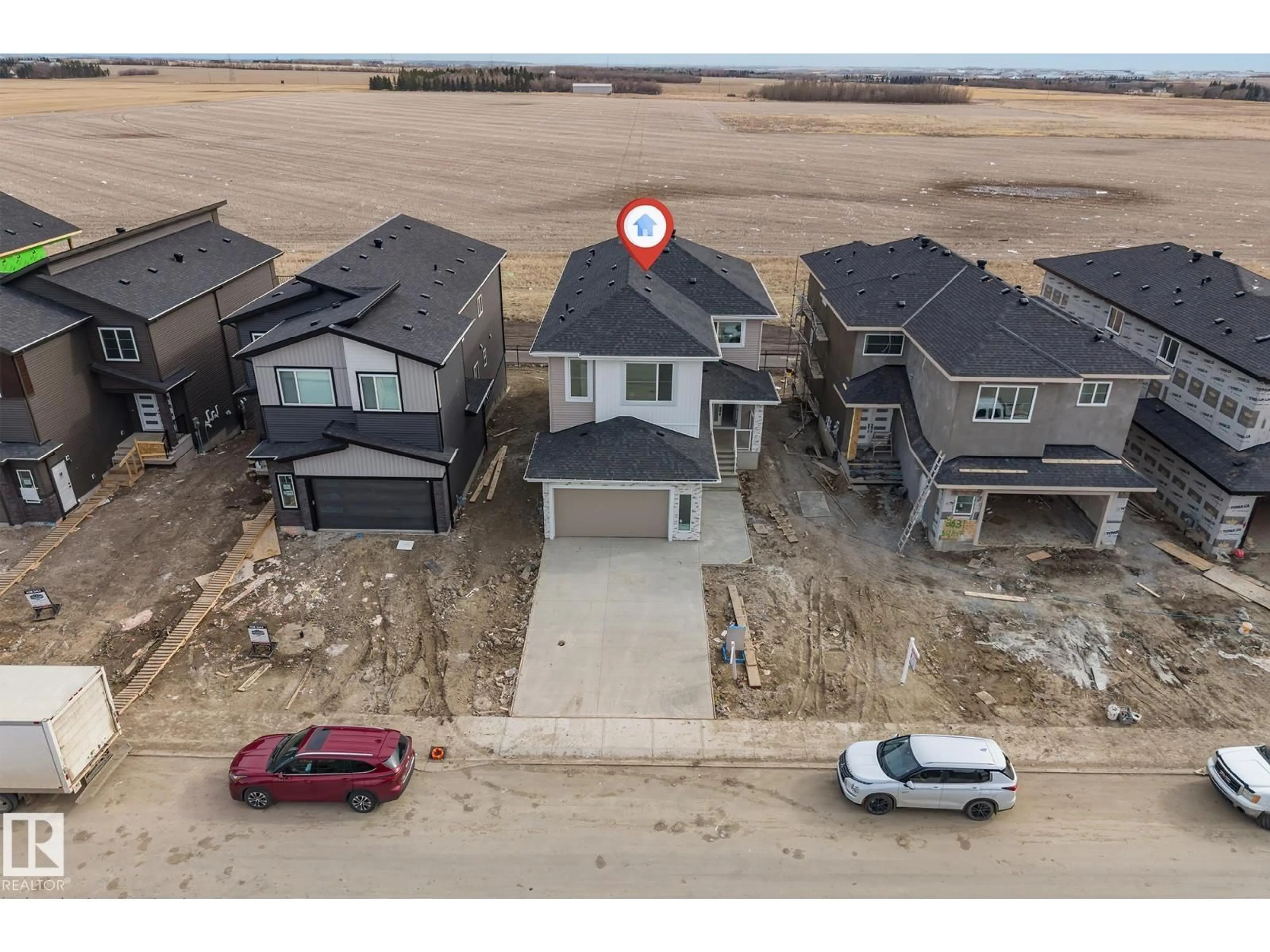 A pic from outside/outdoor area/front of a property/back of a property/a pic from drone, water/lake/river/ocean view for 2637 64 AV, Rural Leduc County Alberta T4X0H6