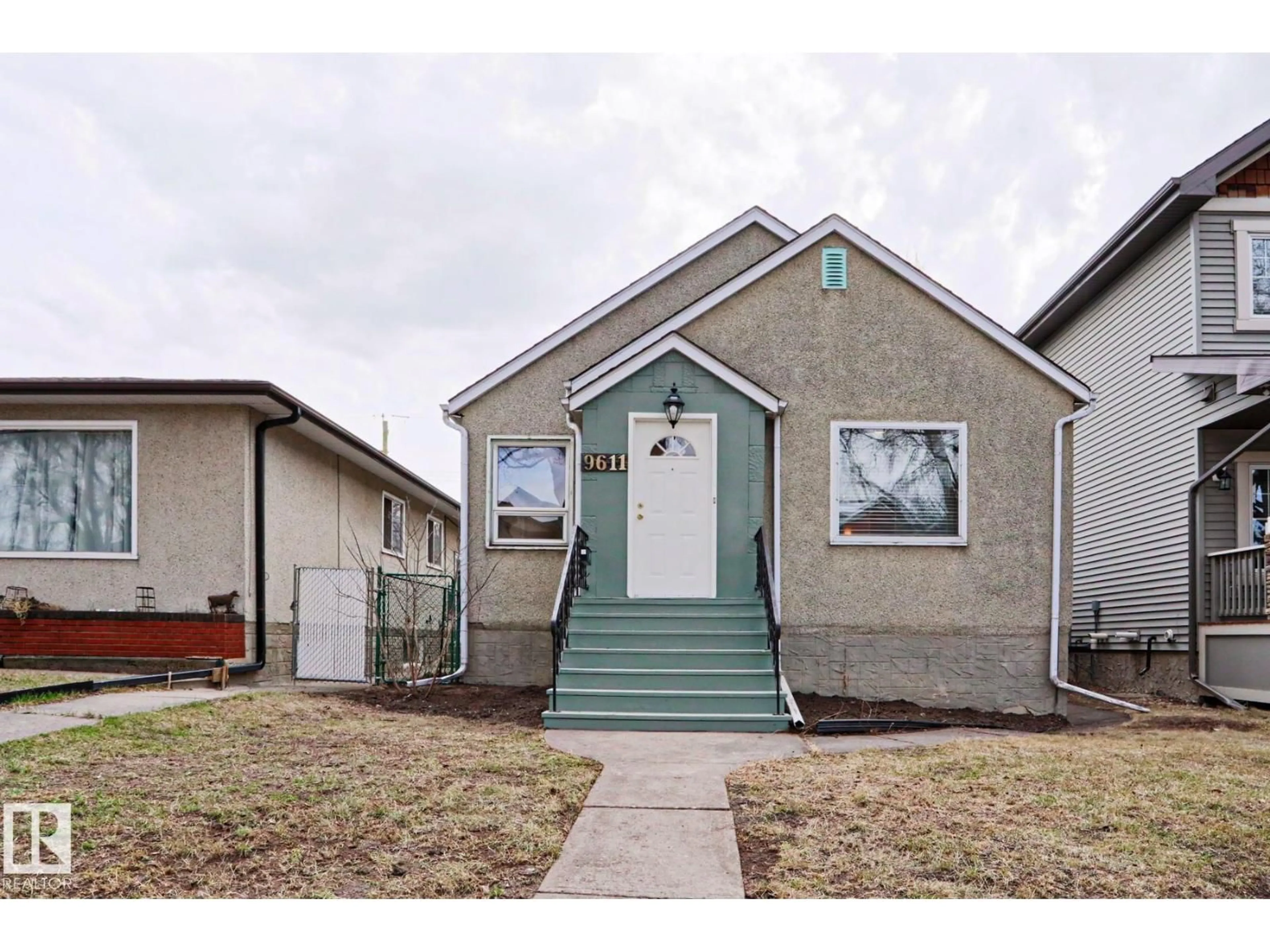 Home with vinyl exterior material, street for NW - 9611 81 AV, Edmonton Alberta T6C0X6