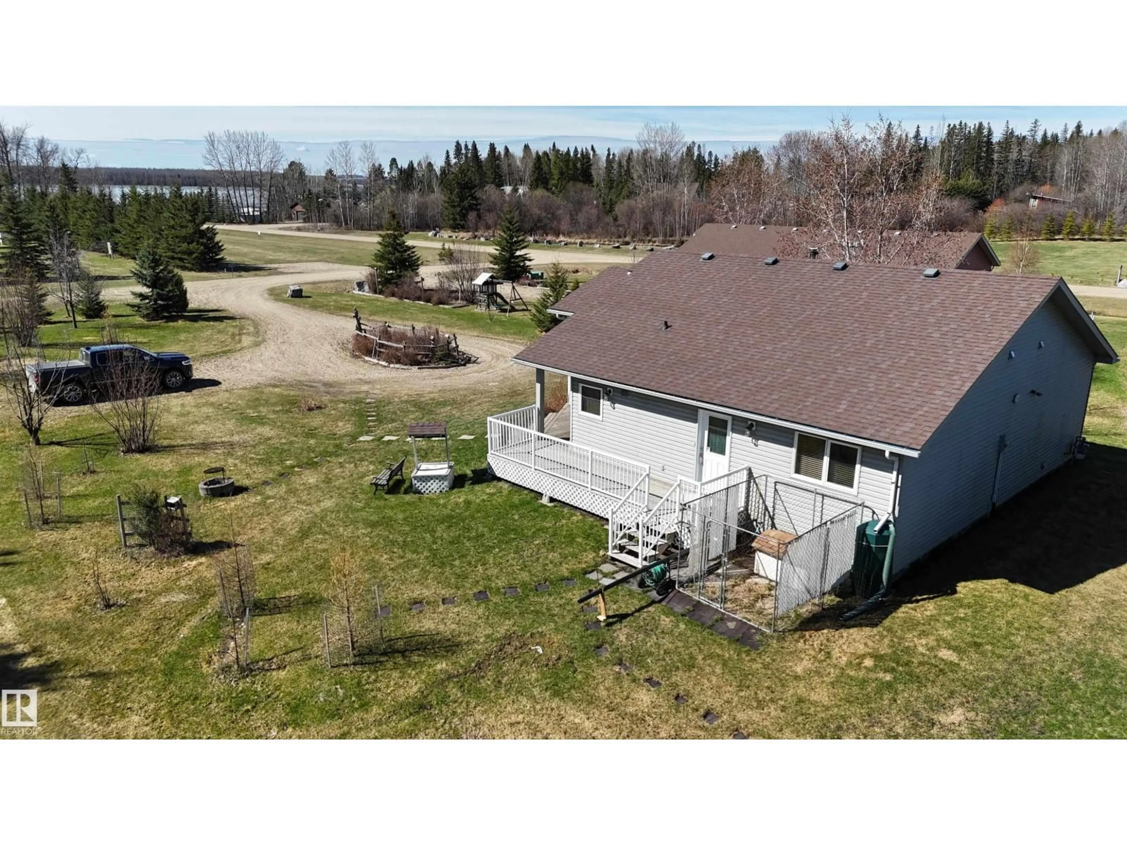 A pic from outside/outdoor area/front of a property/back of a property/a pic from drone, water/lake/river/ocean view for 60 - 504 465044 RR, Rural Wetaskiwin County Alberta T0C0T0