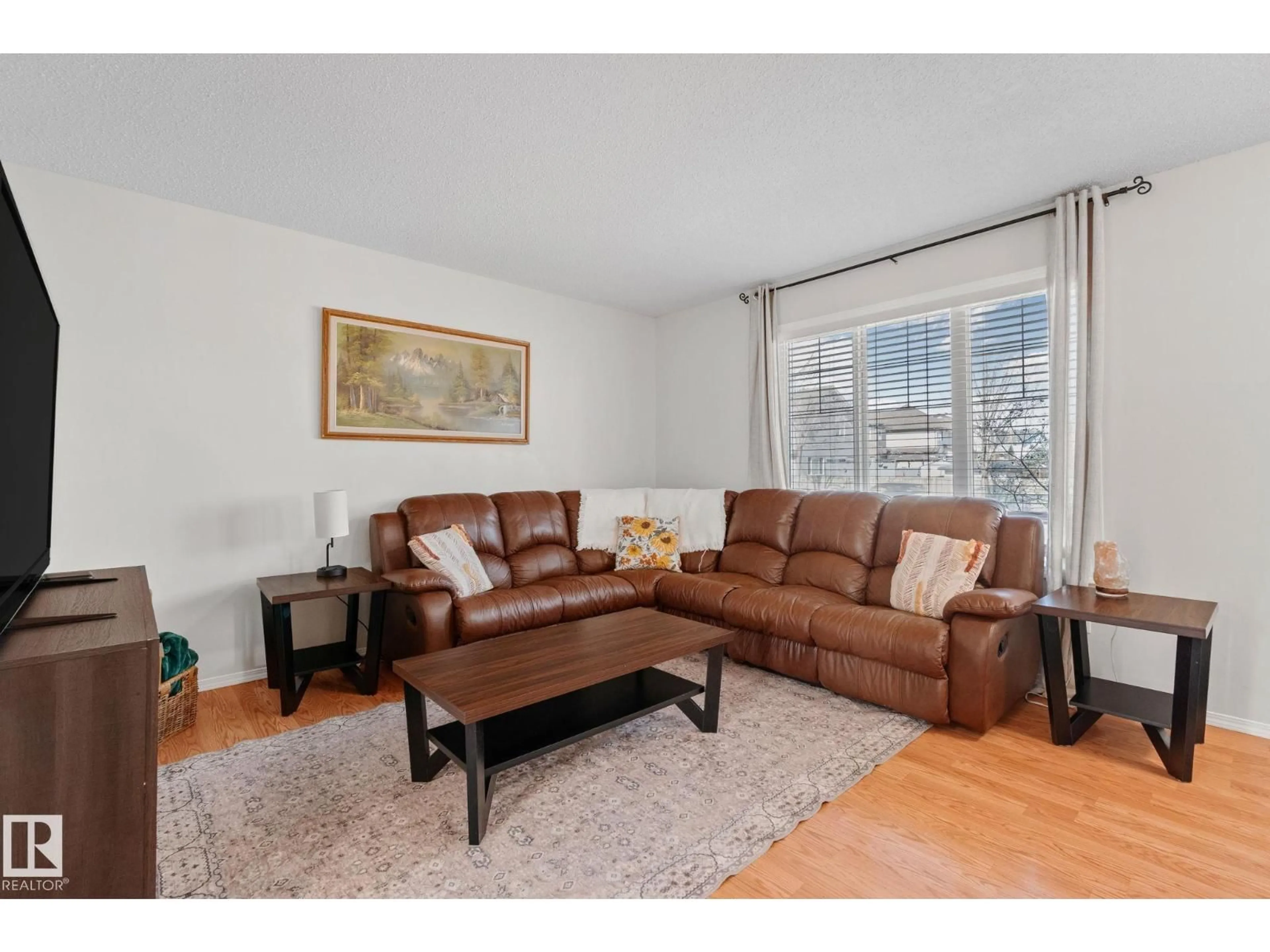 Living room with furniture, wood/laminate floor for 14 ALLARD WY, Fort Saskatchewan Alberta T8L0C3