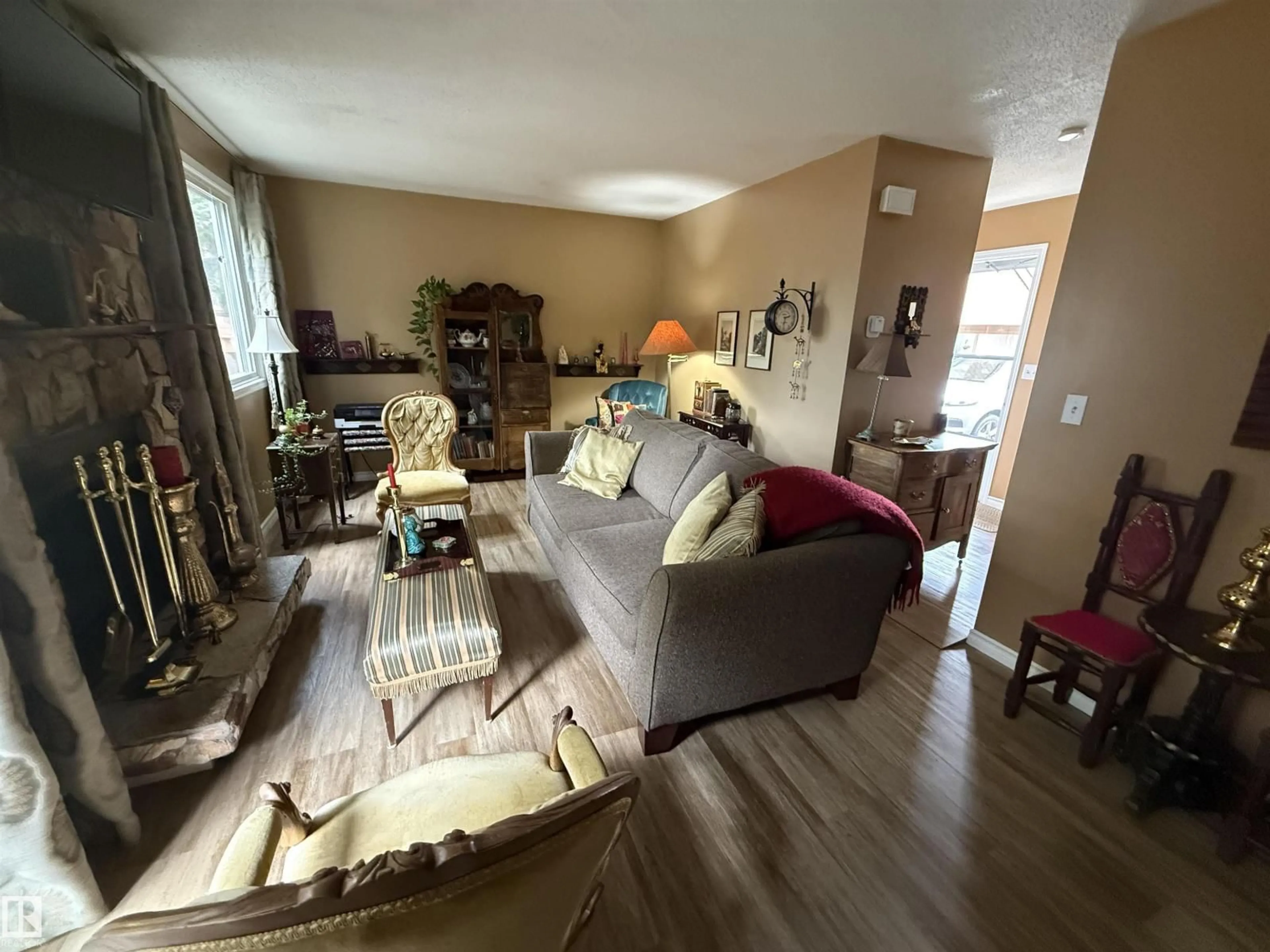 Living room with furniture, unknown for 18525 66 AV, Edmonton Alberta T5T2M3