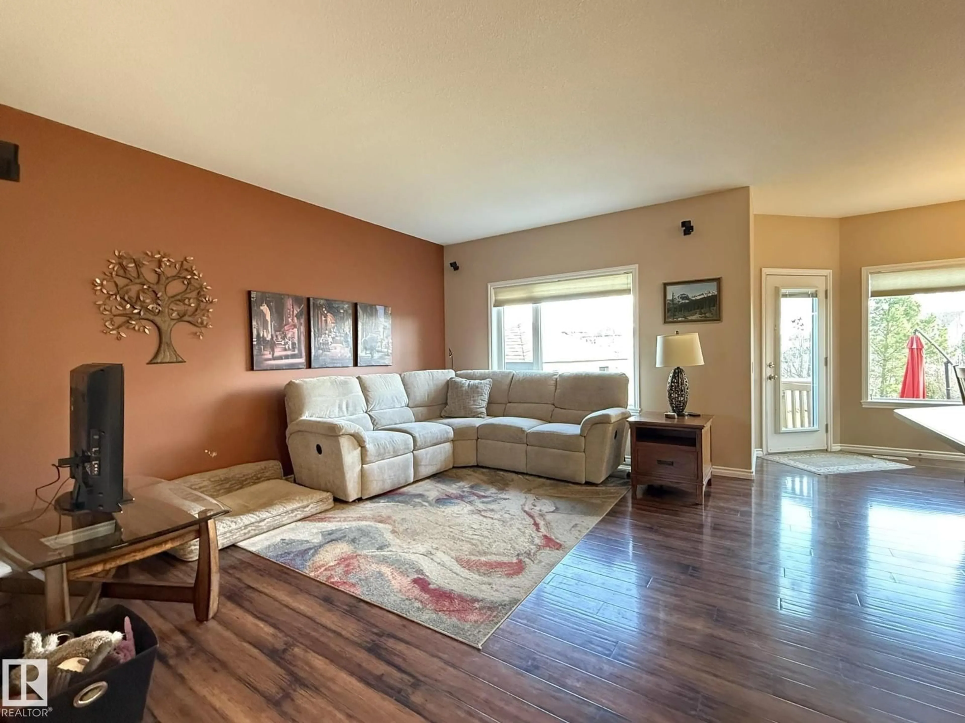 Living room with furniture, wood/laminate floor for 43 SELKIRK PL, Leduc Alberta T9E0L4