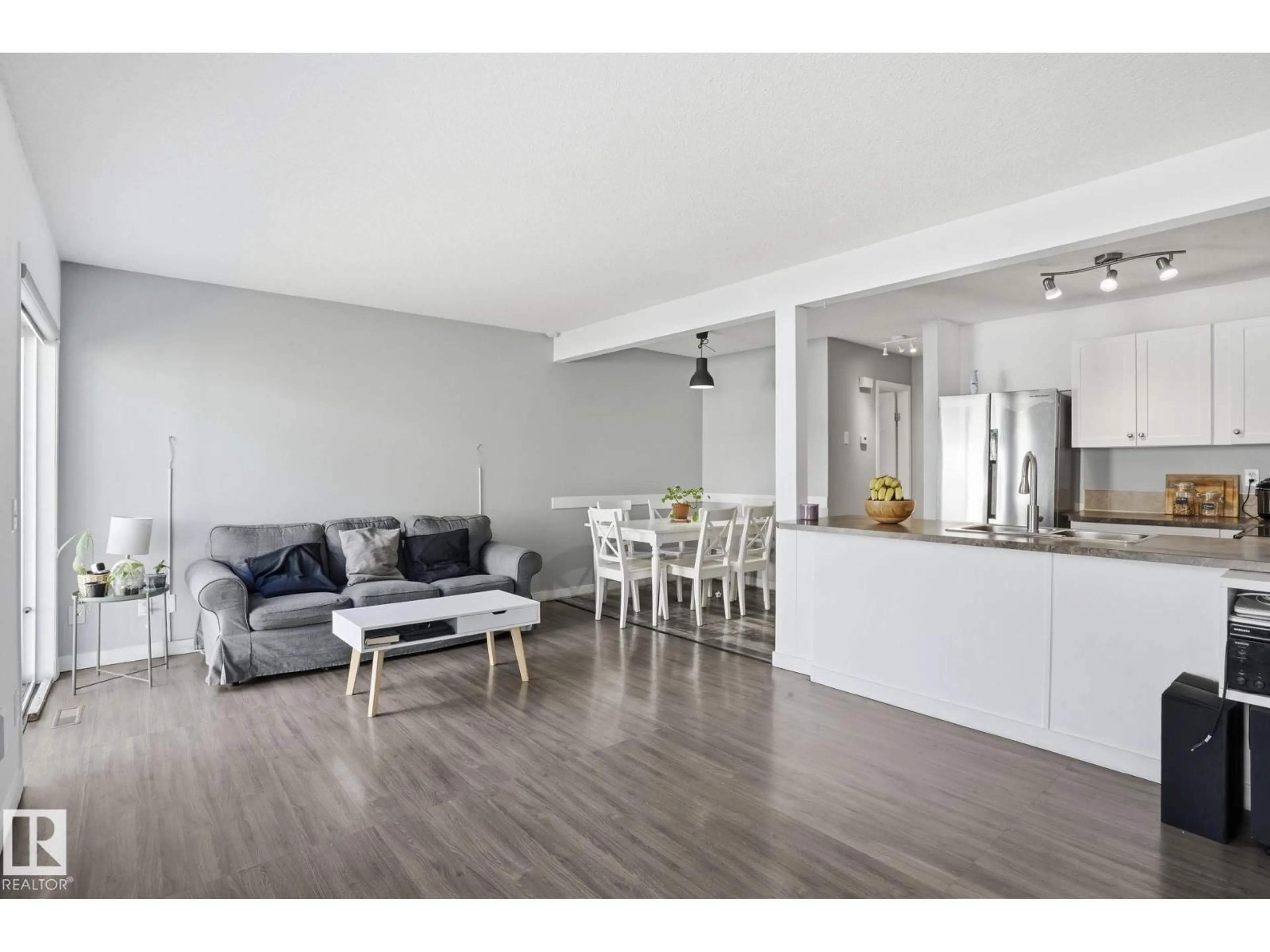 Open concept kitchen, wood/laminate floor for #123 - 150 EDWARDS DR, Edmonton Alberta T6X1M4