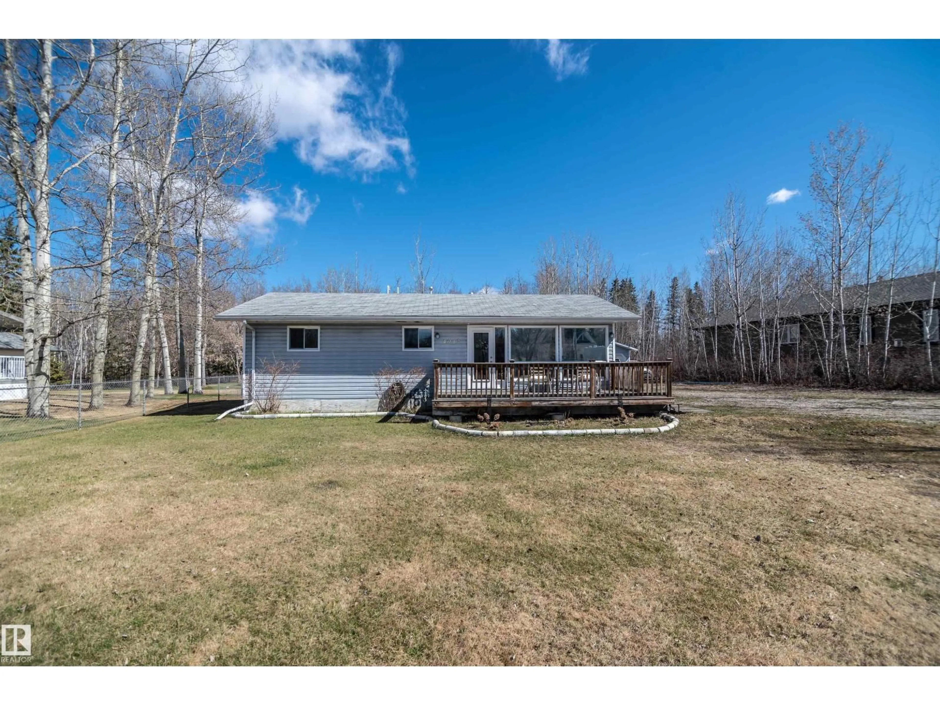A pic from outside/outdoor area/front of a property/back of a property/a pic from drone, water/lake/river/ocean view for 4912 49A AV, Rural Lac Ste. Anne County Alberta T0E0A0