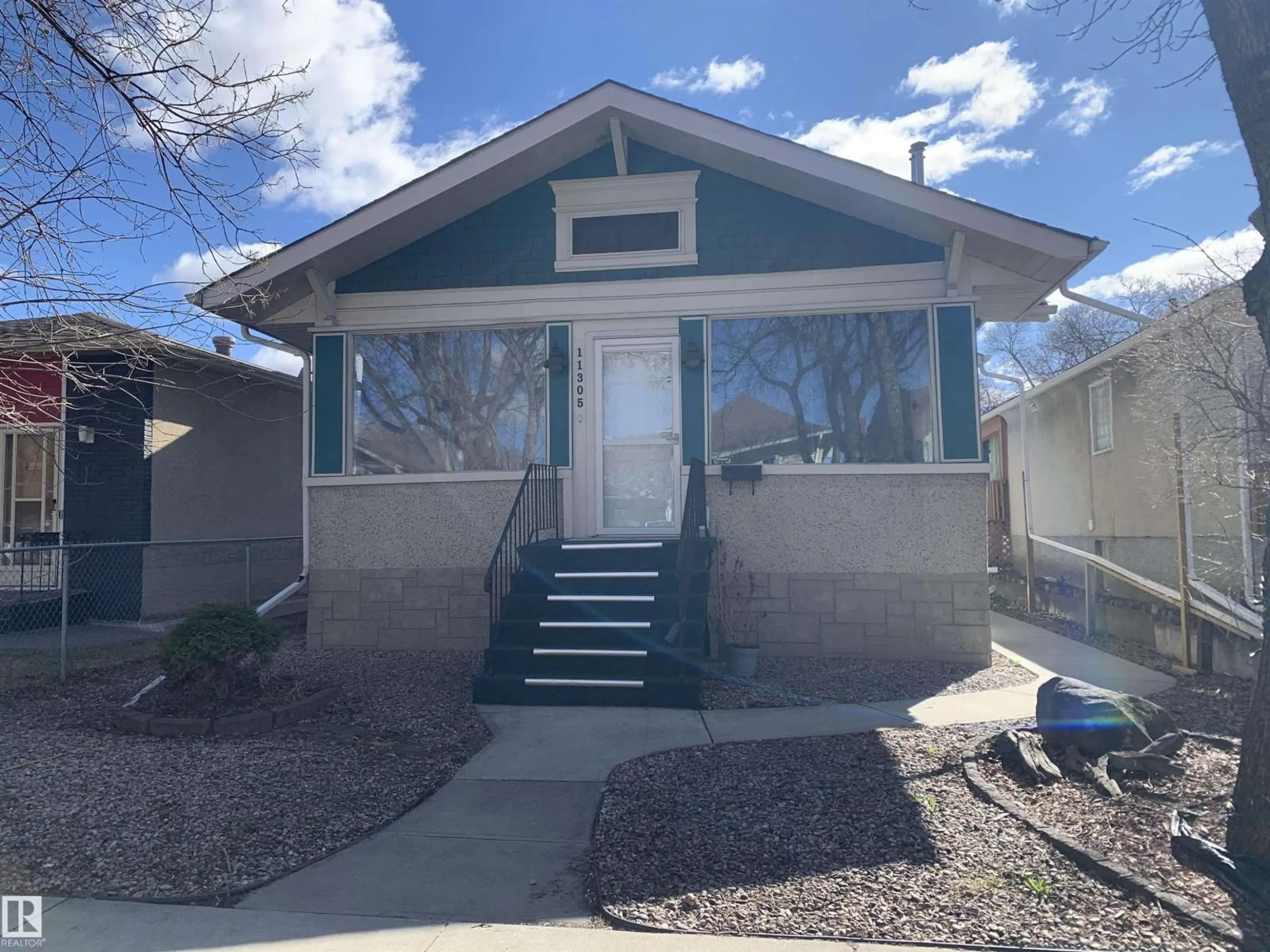 Home with vinyl exterior material, street for NW - 11305 89 ST, Edmonton Alberta T5B3T5