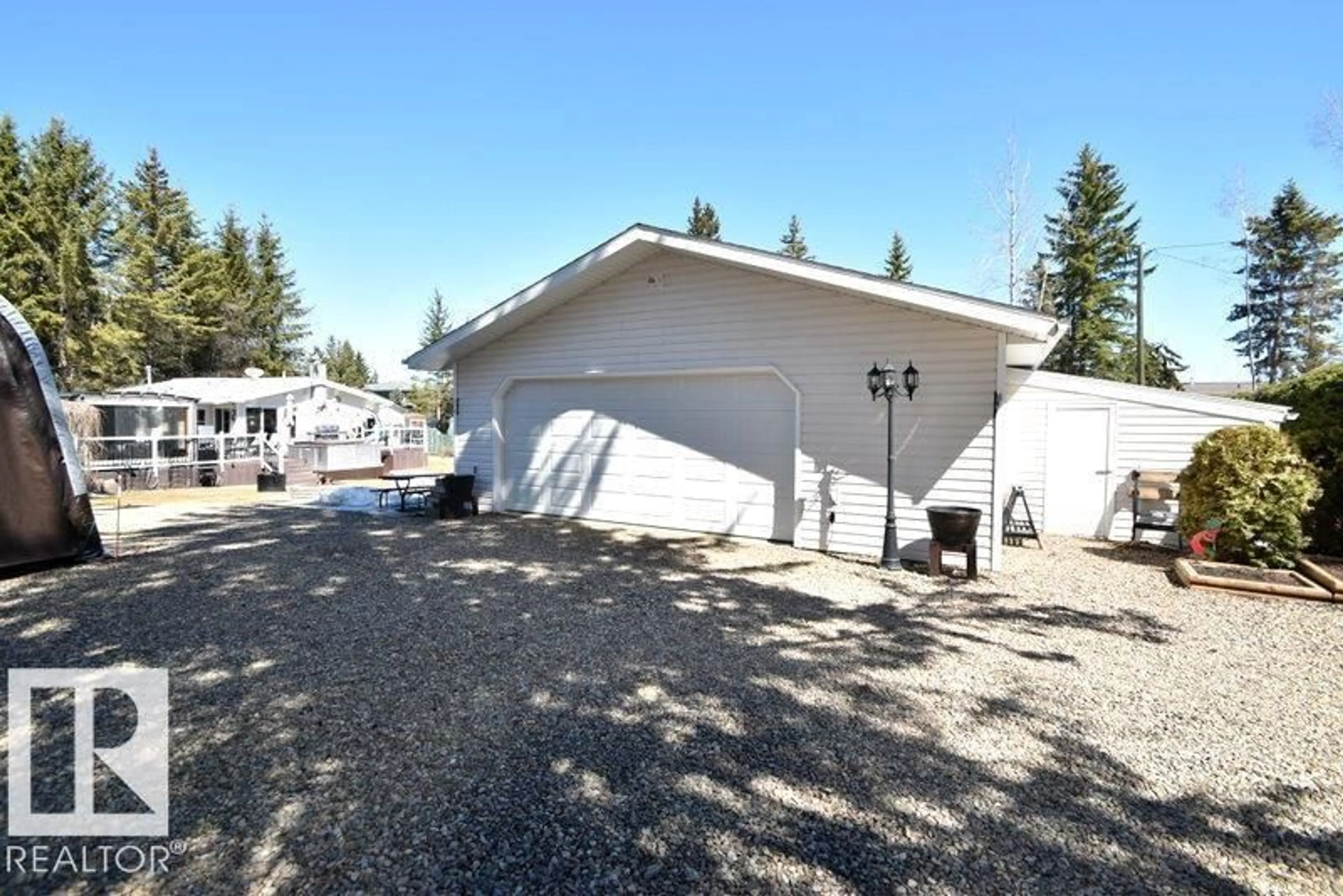 Home with vinyl exterior material, street for 64 ROBIN LANE, Rural Athabasca County Alberta T0A0M0