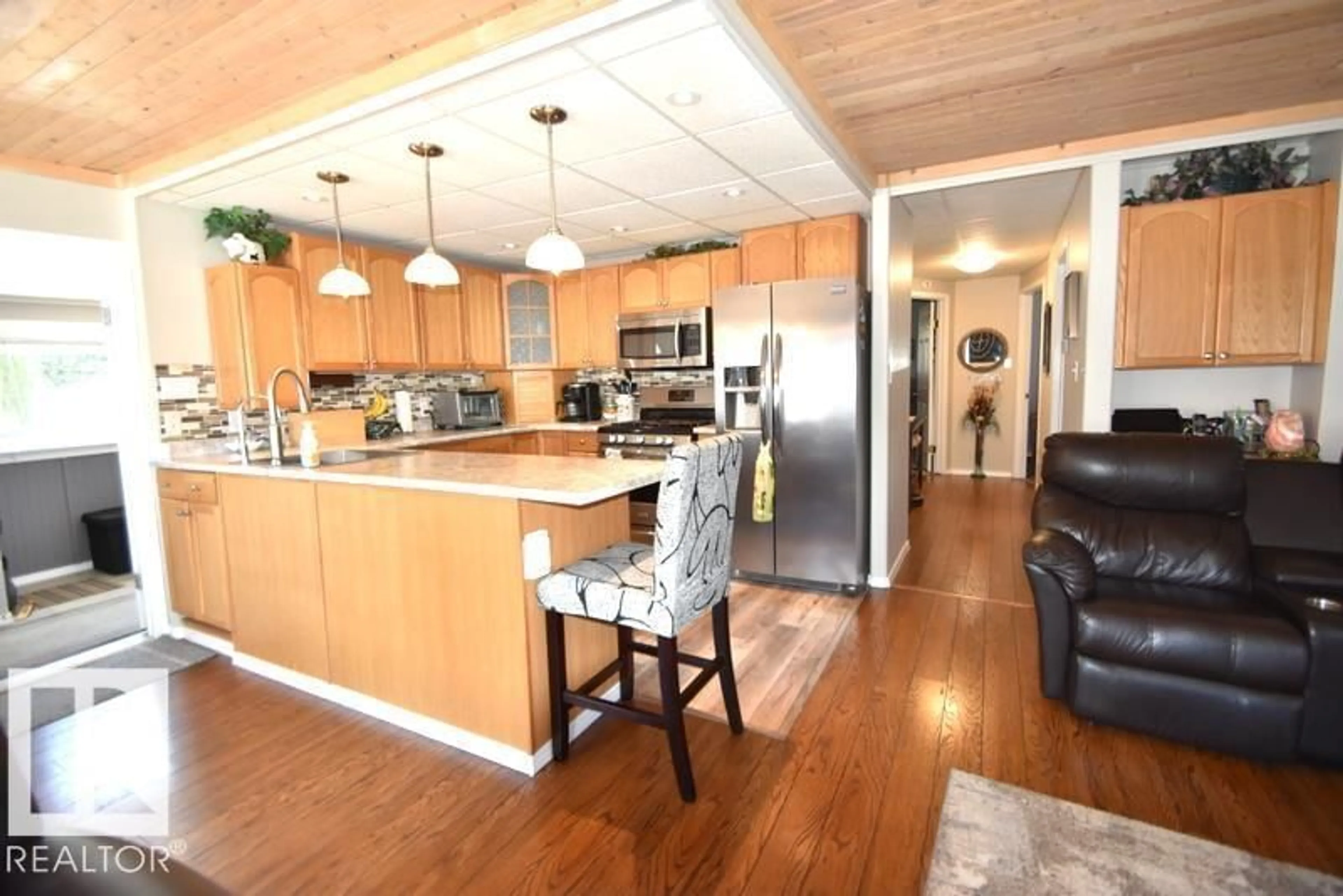 Open concept kitchen, wood/laminate floor for 64 ROBIN LANE, Rural Athabasca County Alberta T0A0M0