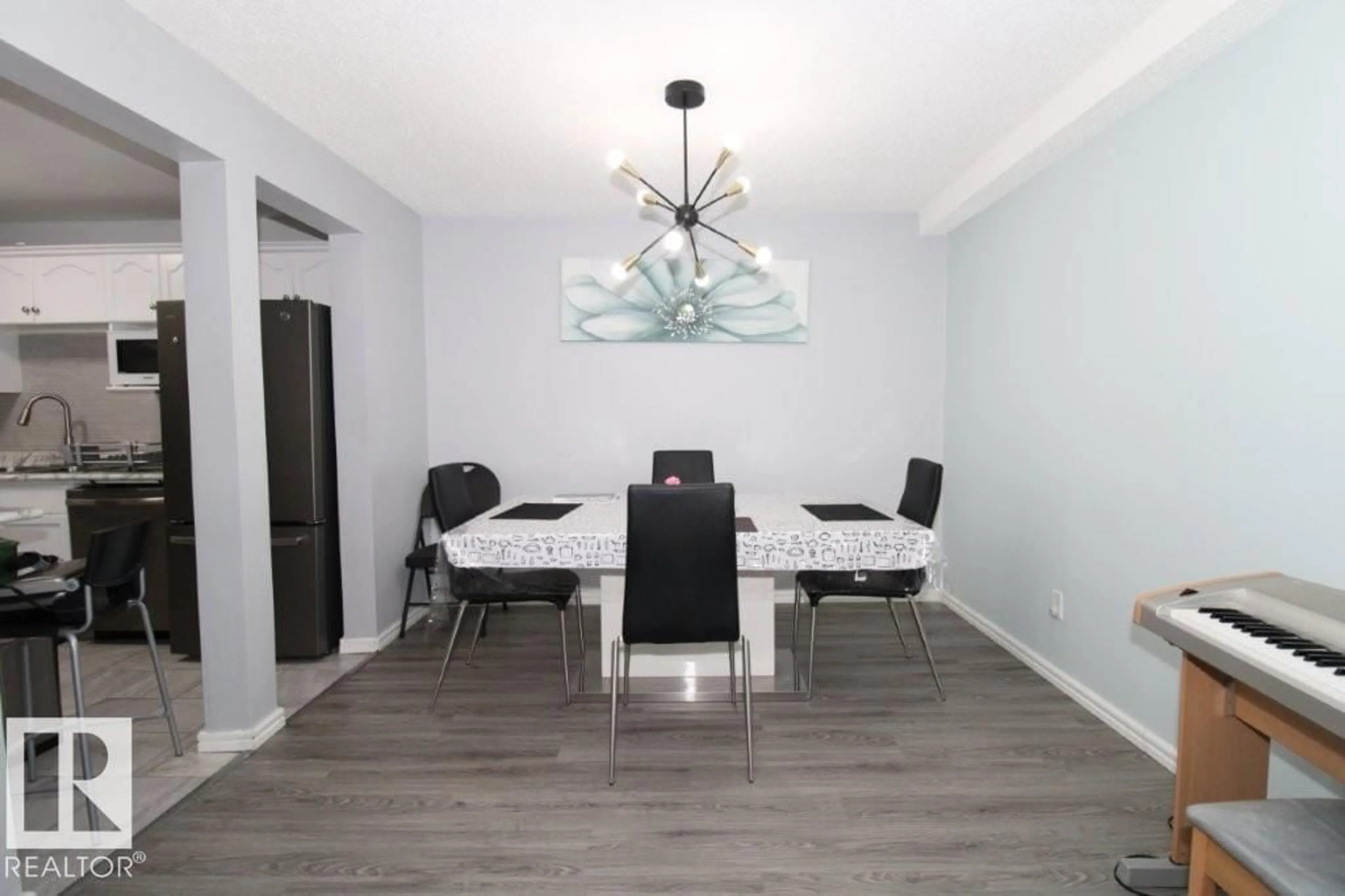 Dining room, wood/laminate floor for #104 - 1620 48 ST, Edmonton Alberta T6L5P1