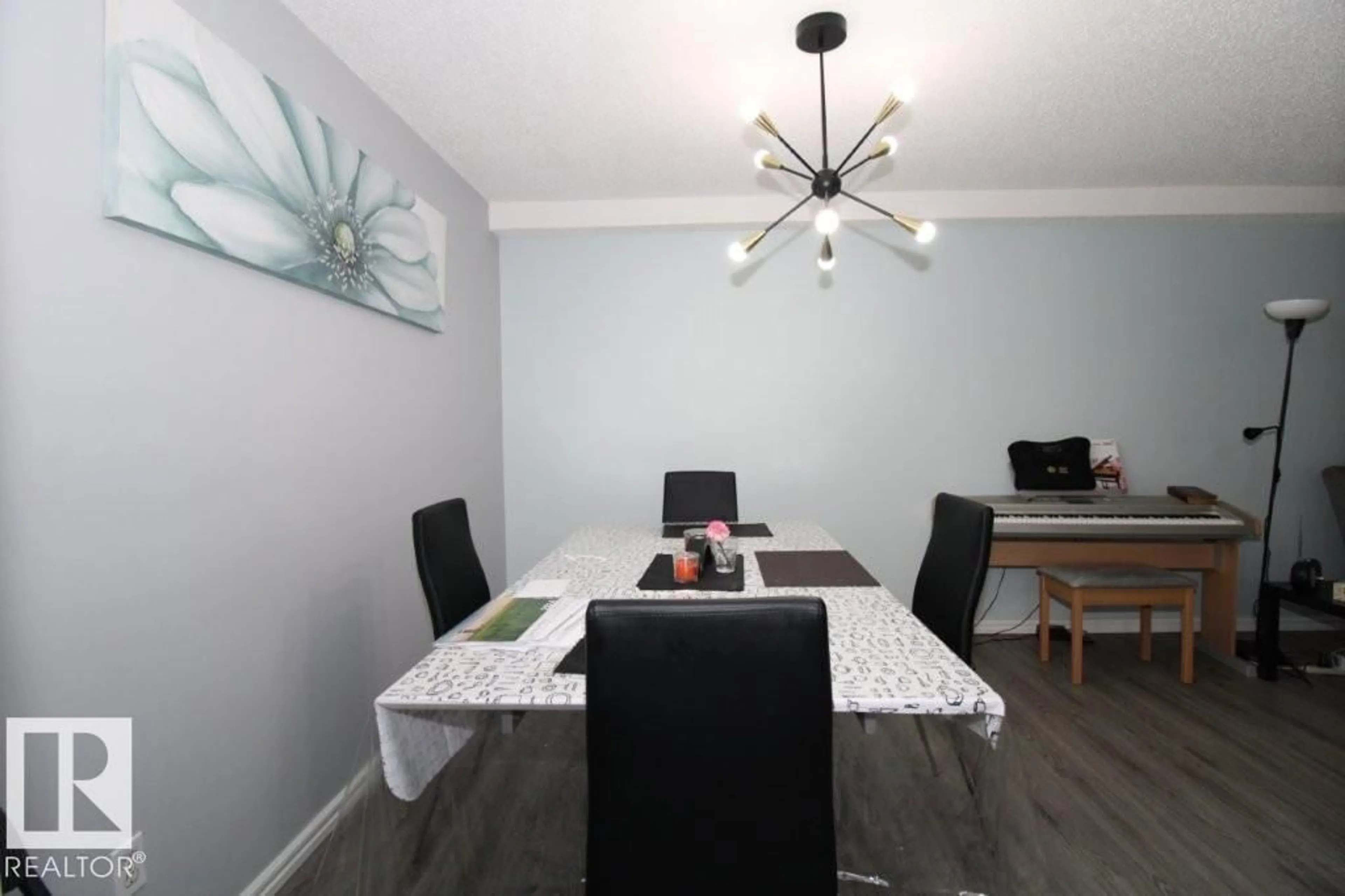 Dining room, wood/laminate floor for #104 - 1620 48 ST, Edmonton Alberta T6L5P1