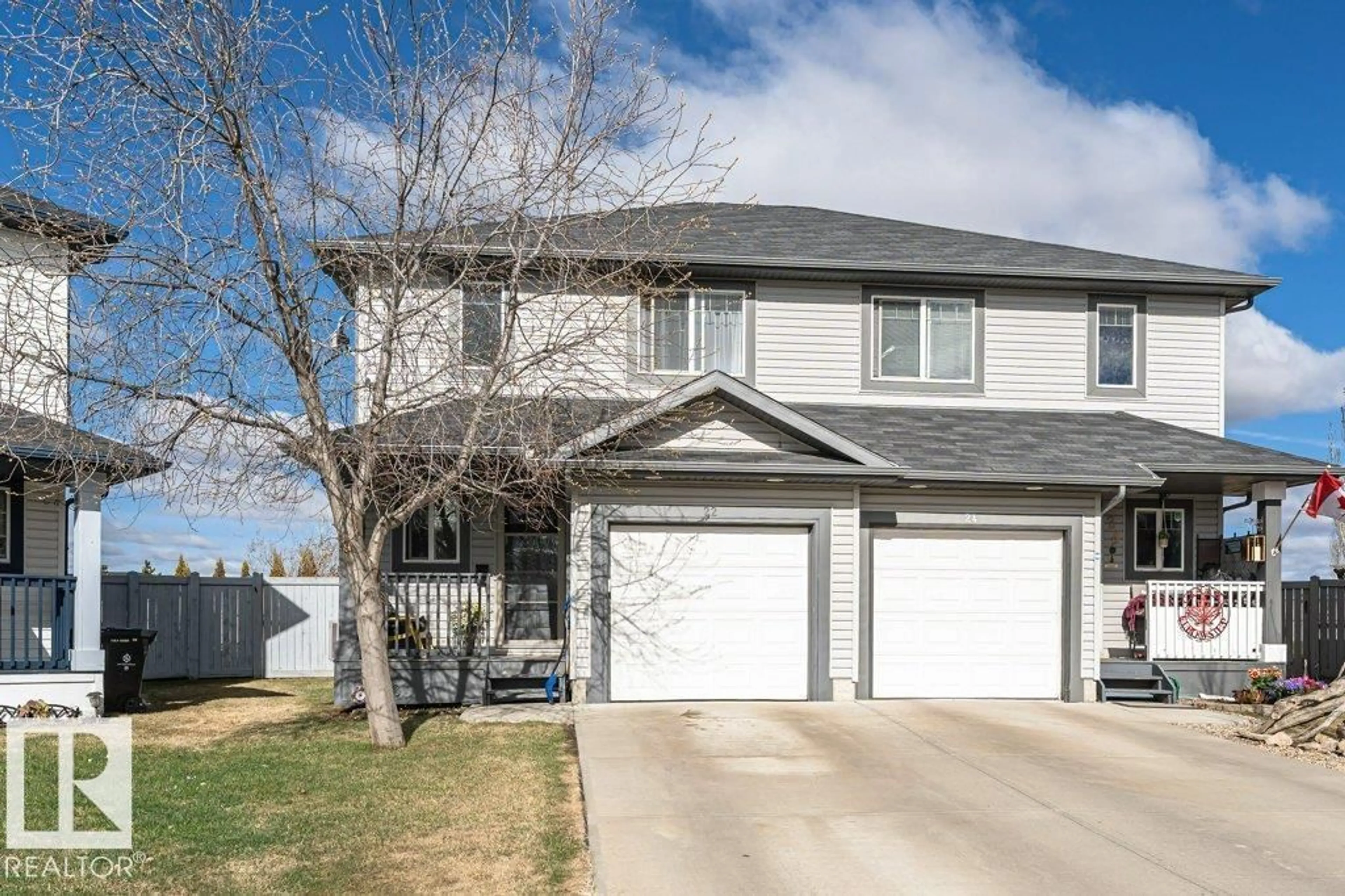 Home with vinyl exterior material, street for 22 REED, Fort Saskatchewan Alberta T8L0E8