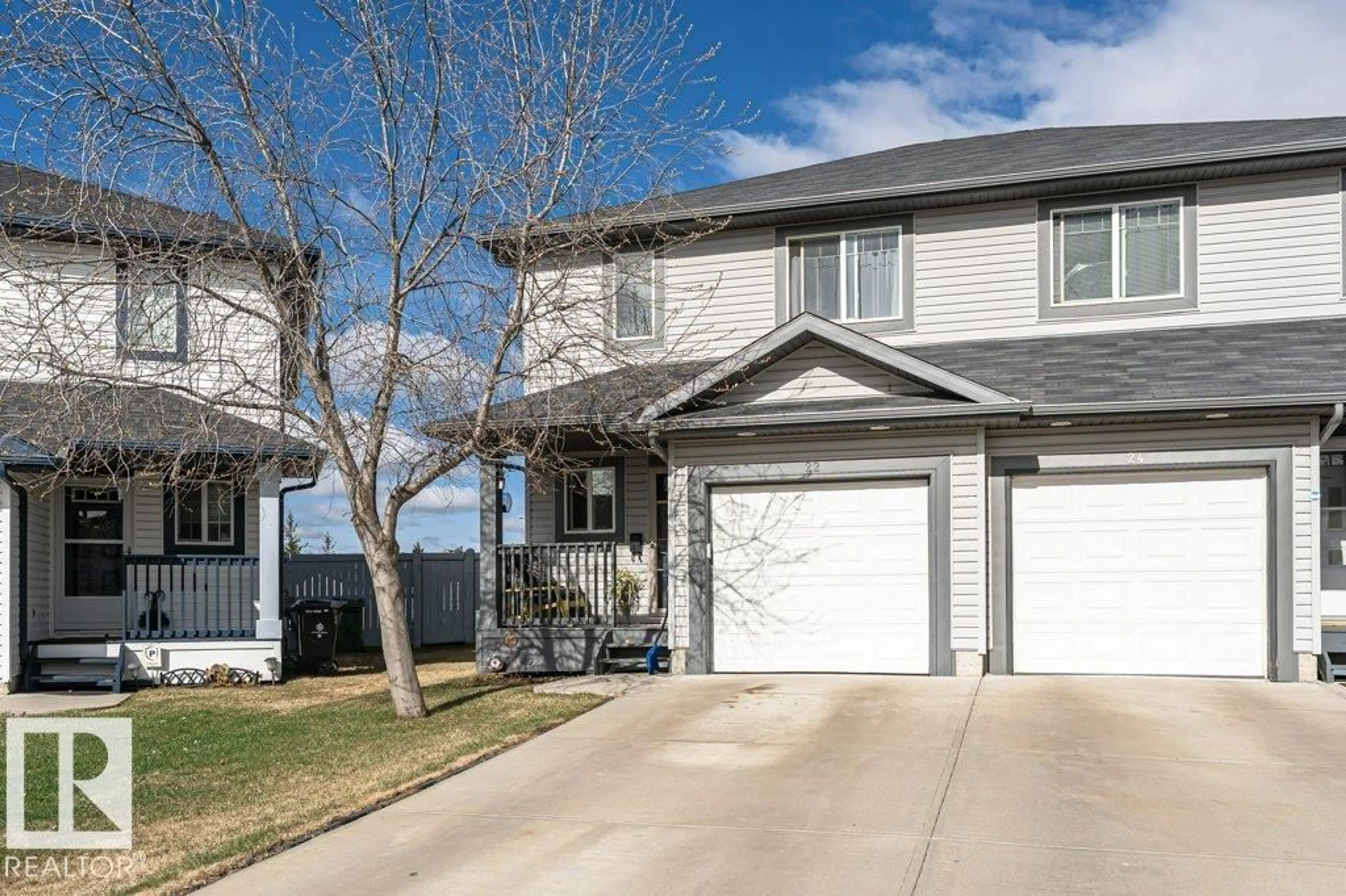 Home with vinyl exterior material, street for 22 REED, Fort Saskatchewan Alberta T8L0E8