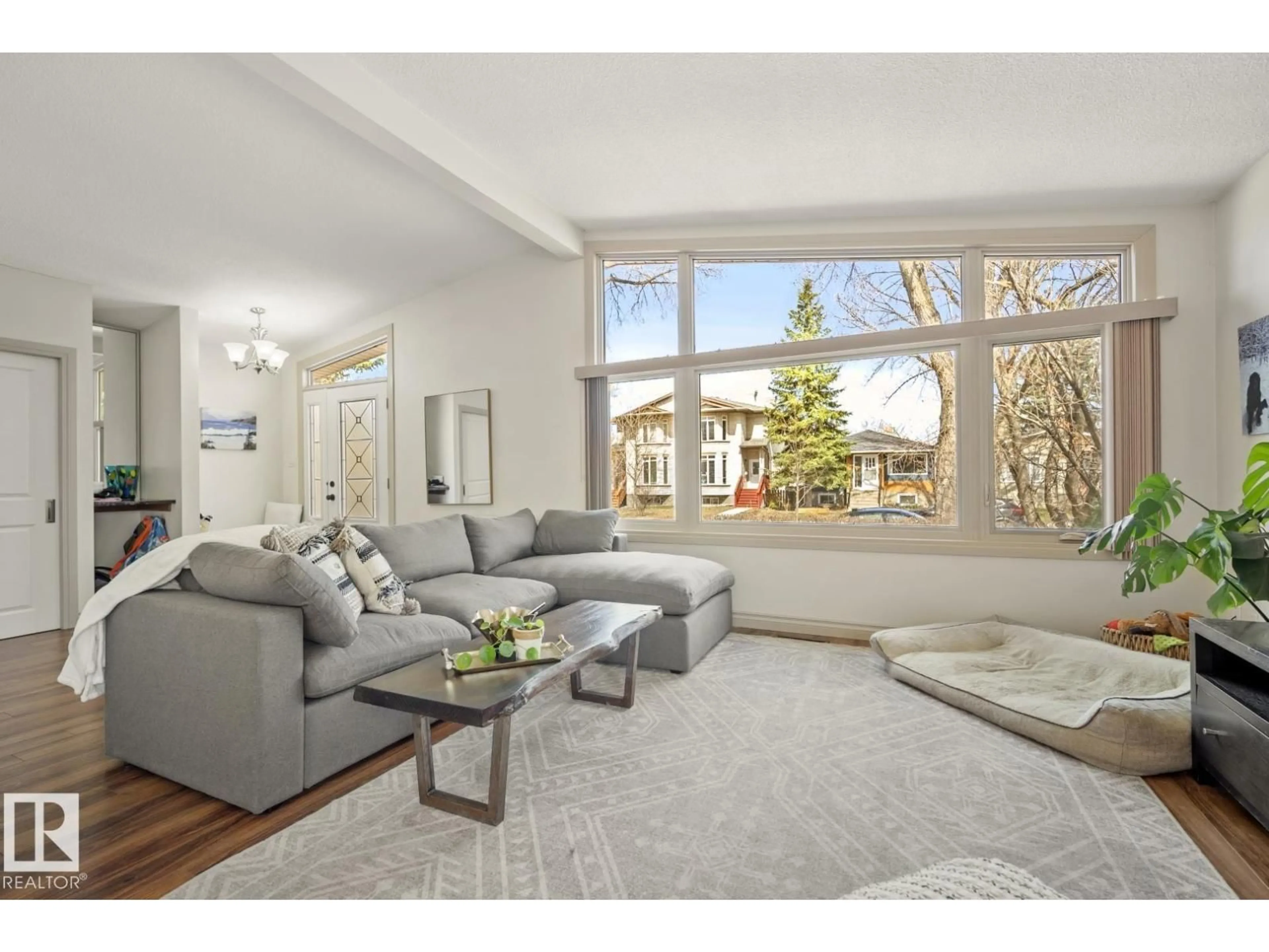Living room with furniture, unknown for 10649 67 AV, Edmonton Alberta T6H1Z7