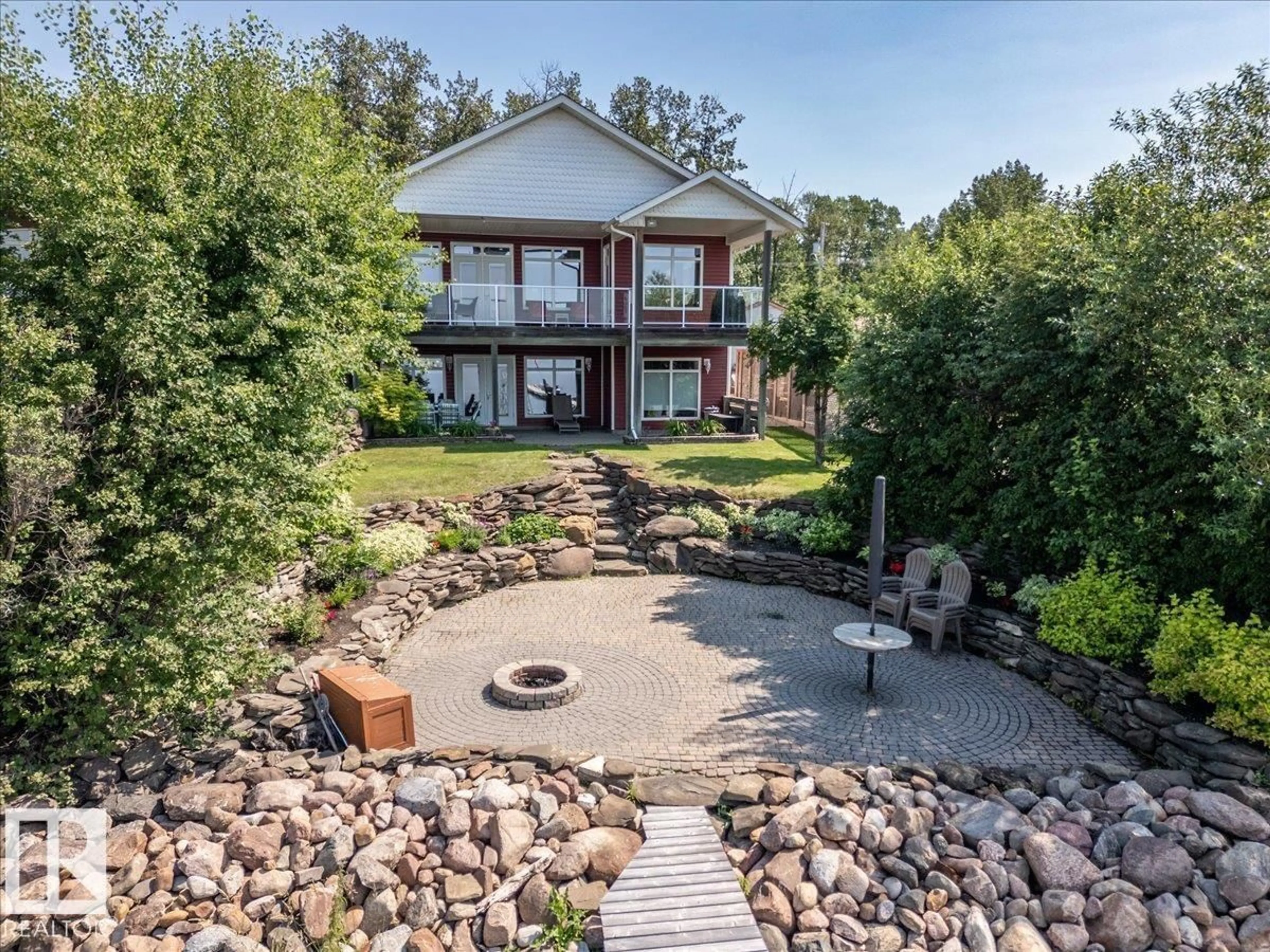 A pic from outside/outdoor area/front of a property/back of a property/a pic from drone, water/lake/river/ocean view for 72 BEACH AVE, Rural Leduc County Alberta T0C2C0
