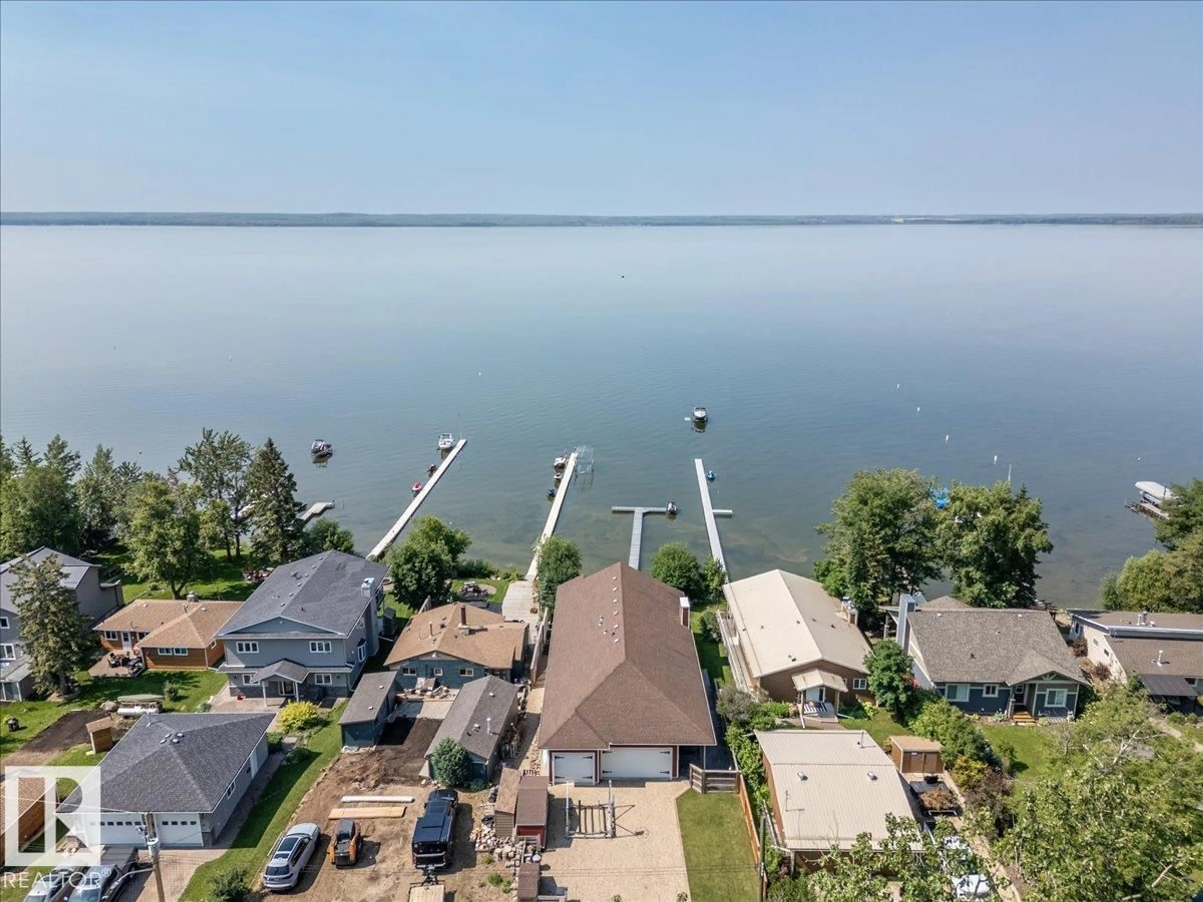 A pic from outside/outdoor area/front of a property/back of a property/a pic from drone, water/lake/river/ocean view for 72 BEACH AVE, Rural Leduc County Alberta T0C2C0