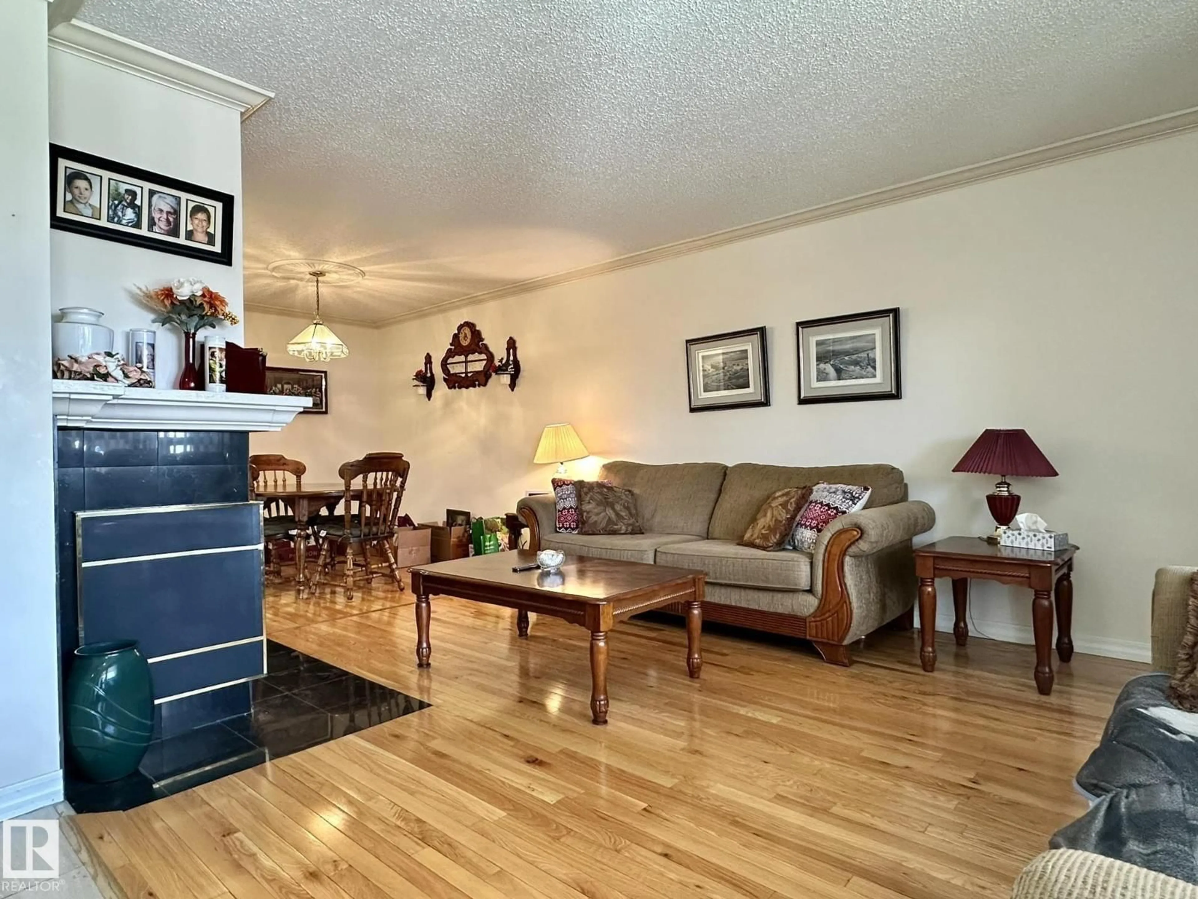 Living room with furniture, wood/laminate floor for NW - 2304 151 AV, Edmonton Alberta T5Y2L1