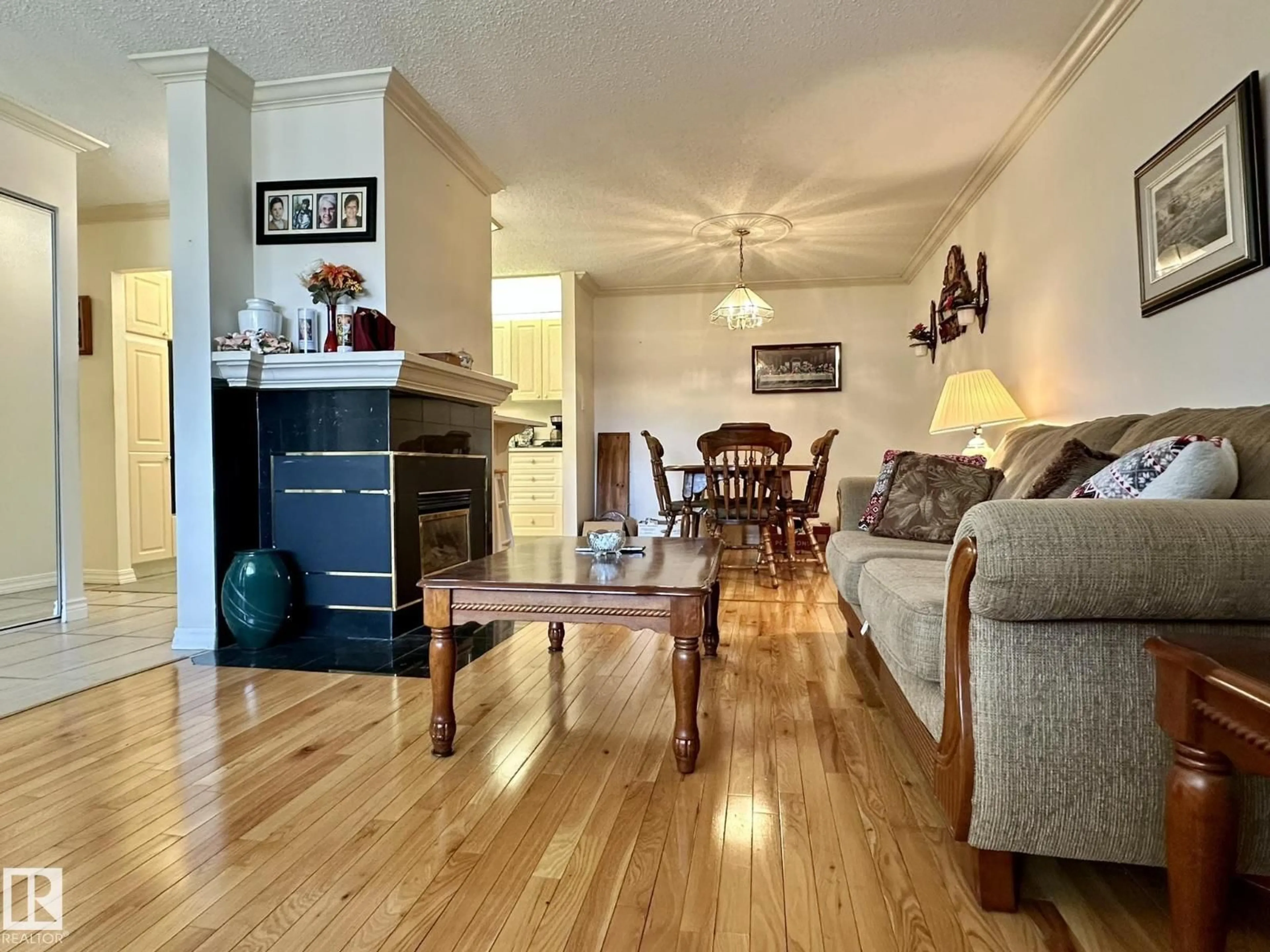 Living room with furniture, wood/laminate floor for NW - 2304 151 AV, Edmonton Alberta T5Y2L1