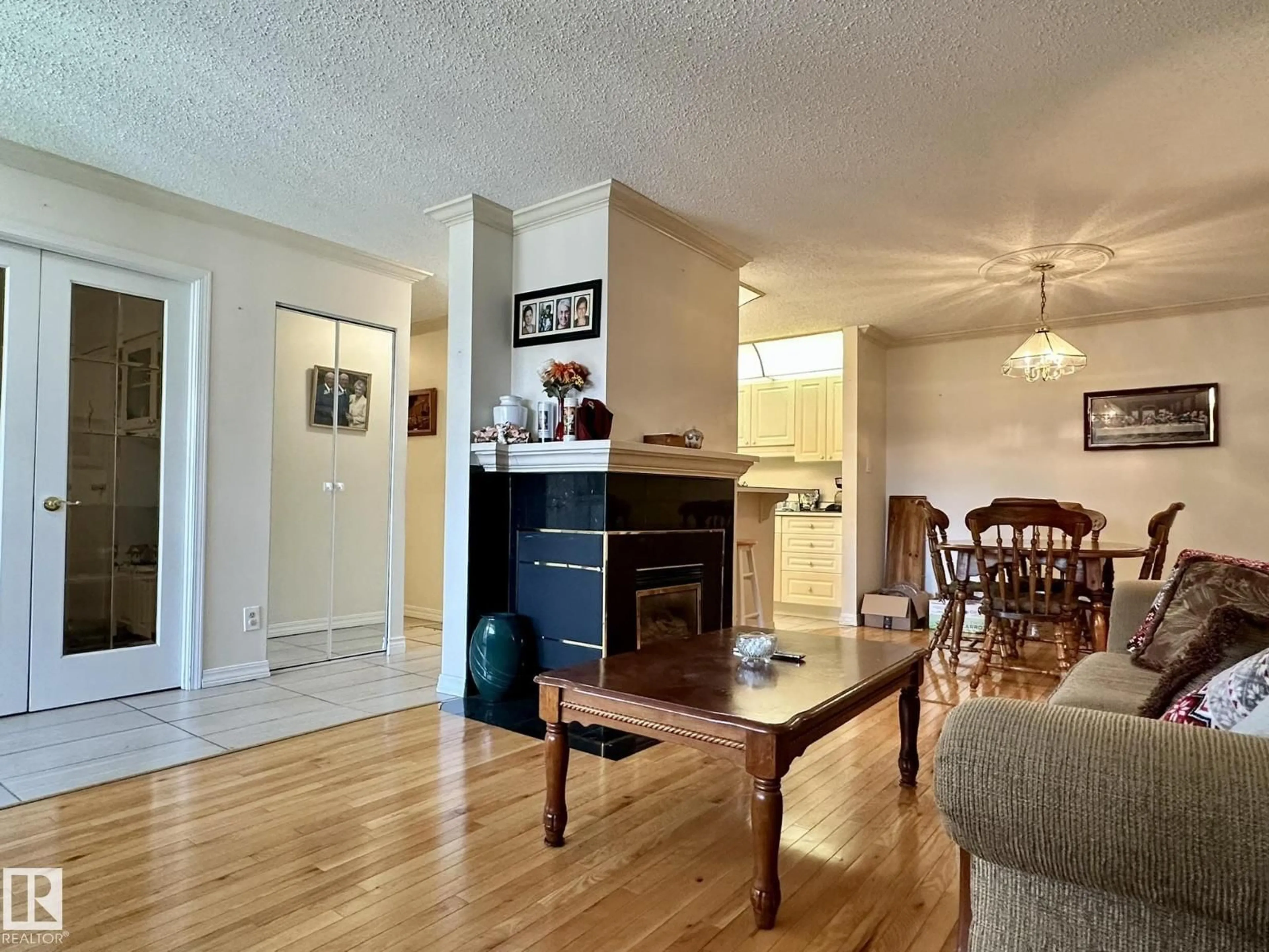 Living room with furniture, wood/laminate floor for NW - 2304 151 AV, Edmonton Alberta T5Y2L1