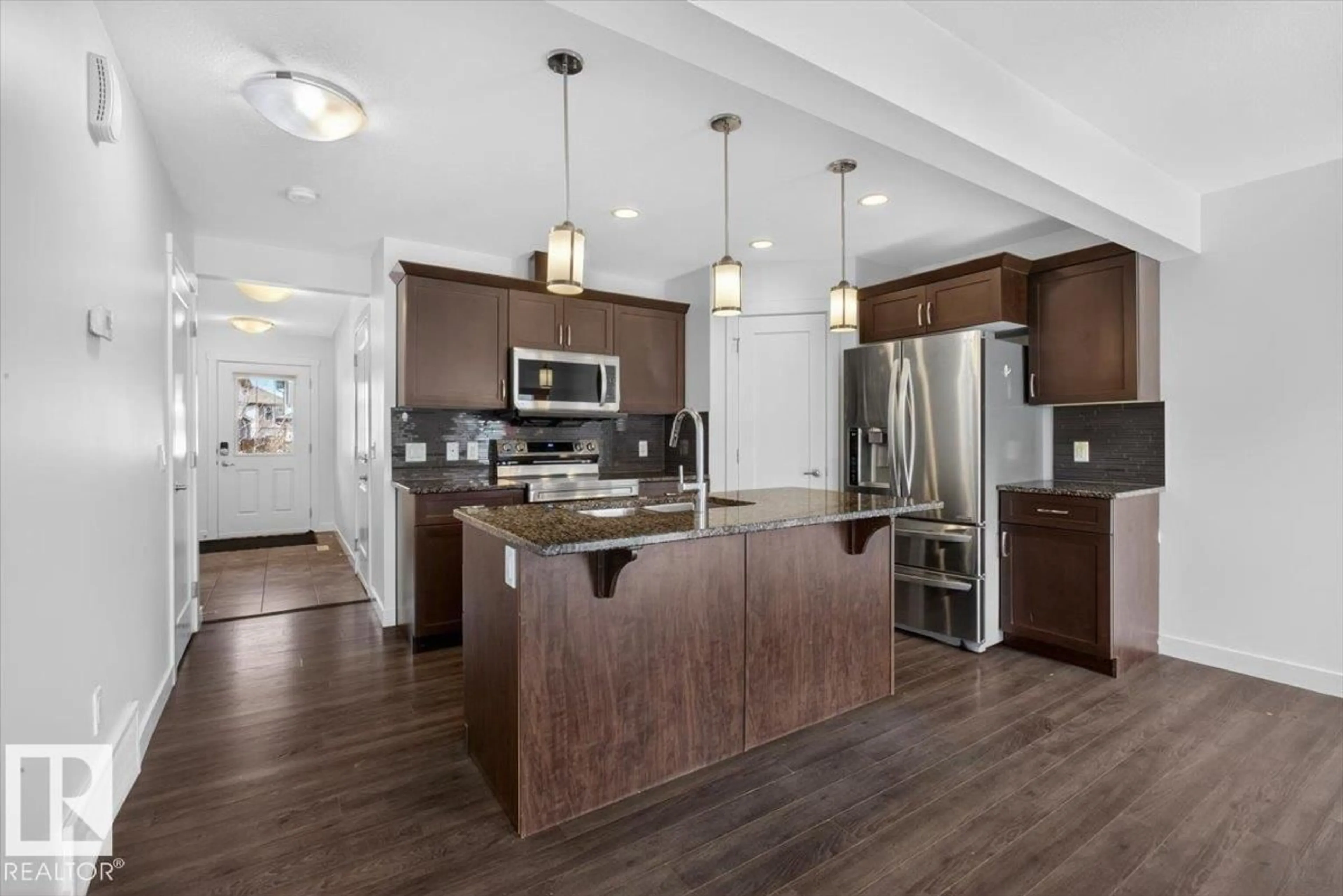 Open concept kitchen, unknown for 20315 43 AV, Edmonton Alberta T6M0R8