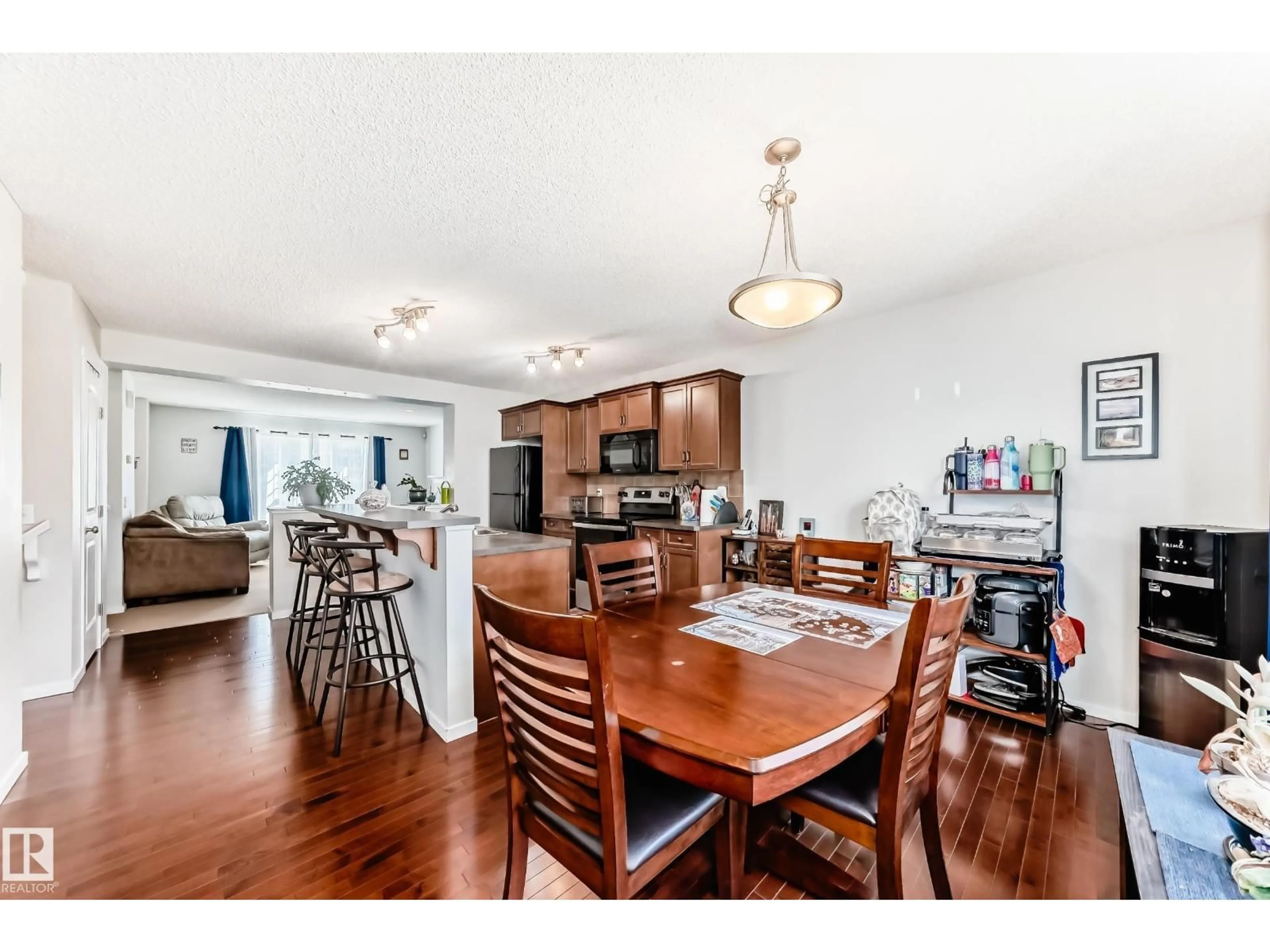 Open concept kitchen, wood/laminate floor for SW - 115 60 ST, Edmonton Alberta T6X0E7