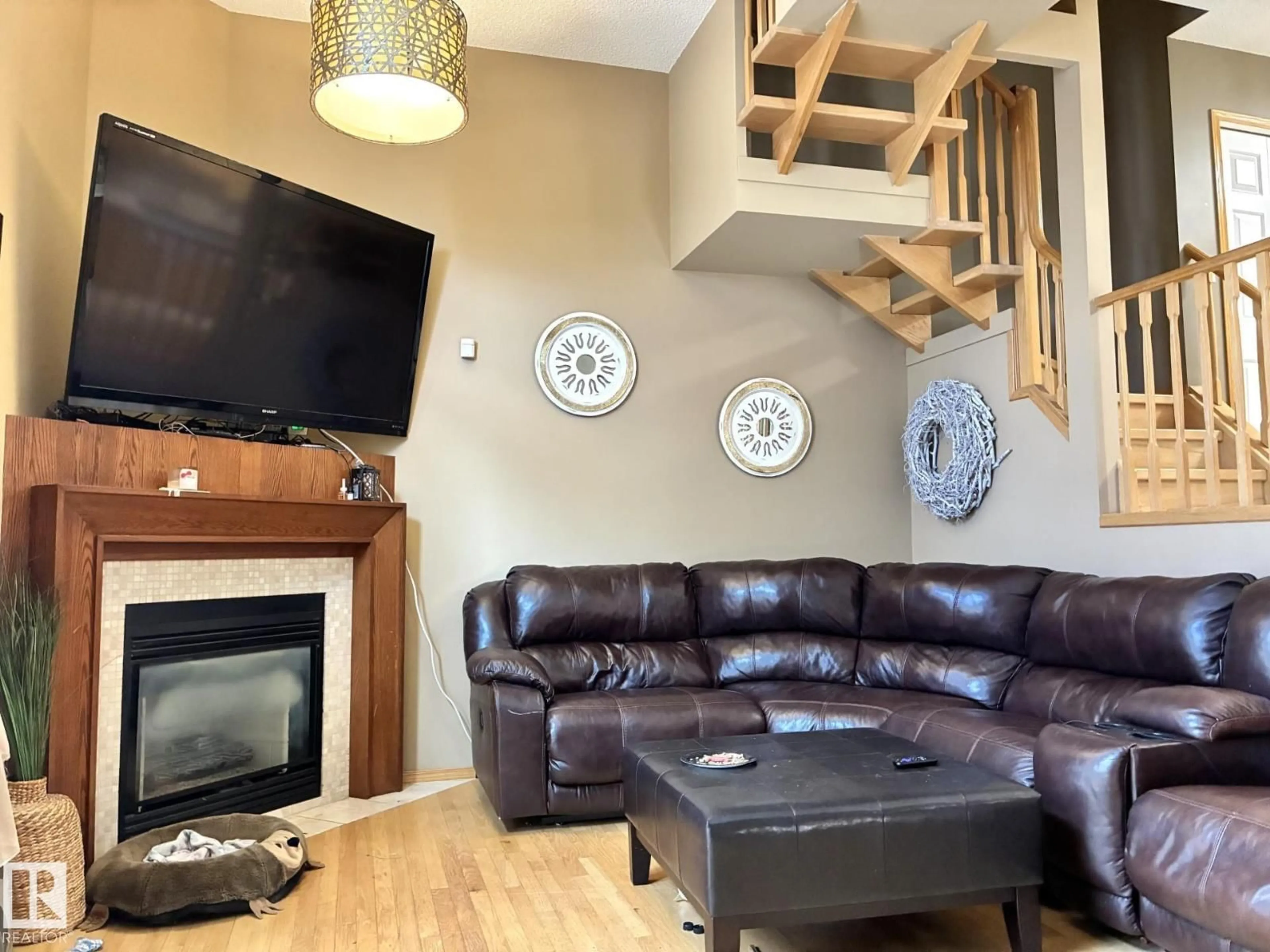 Living room with furniture, wood/laminate floor for 4811 13 AV, Edmonton Alberta T6L6R6