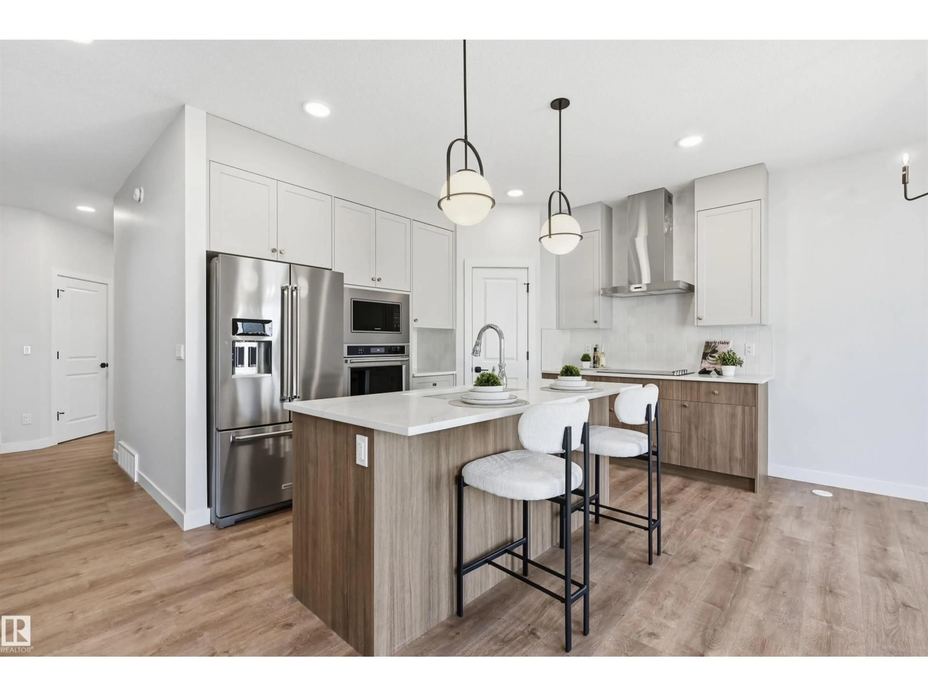 Open concept kitchen, wood/laminate floor for 3024 DIXON LANDING LD, Edmonton Alberta T6W5L1
