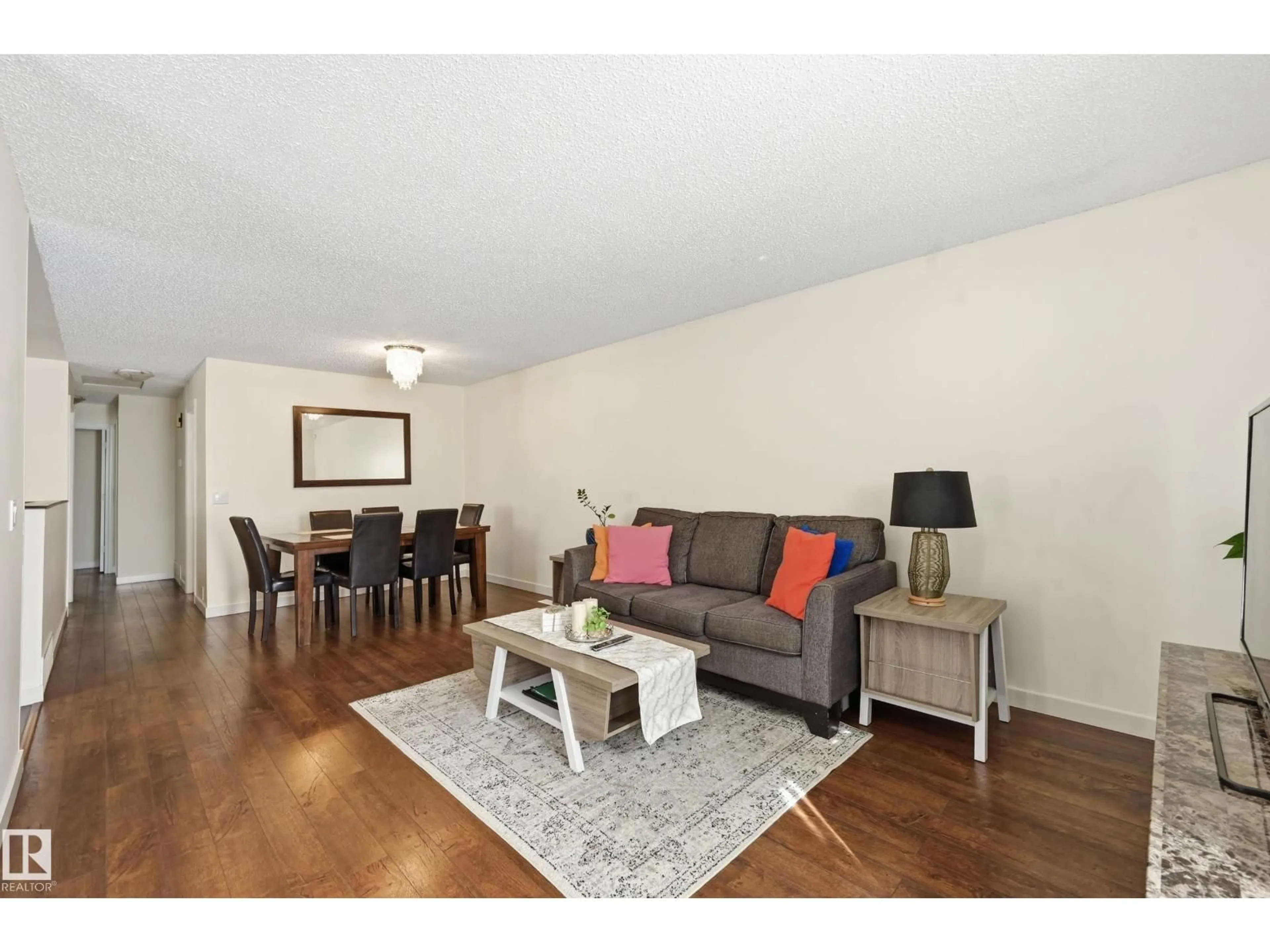 Living room with furniture, wood/laminate floor for 18424 96A AV, Edmonton Alberta T5T3N9
