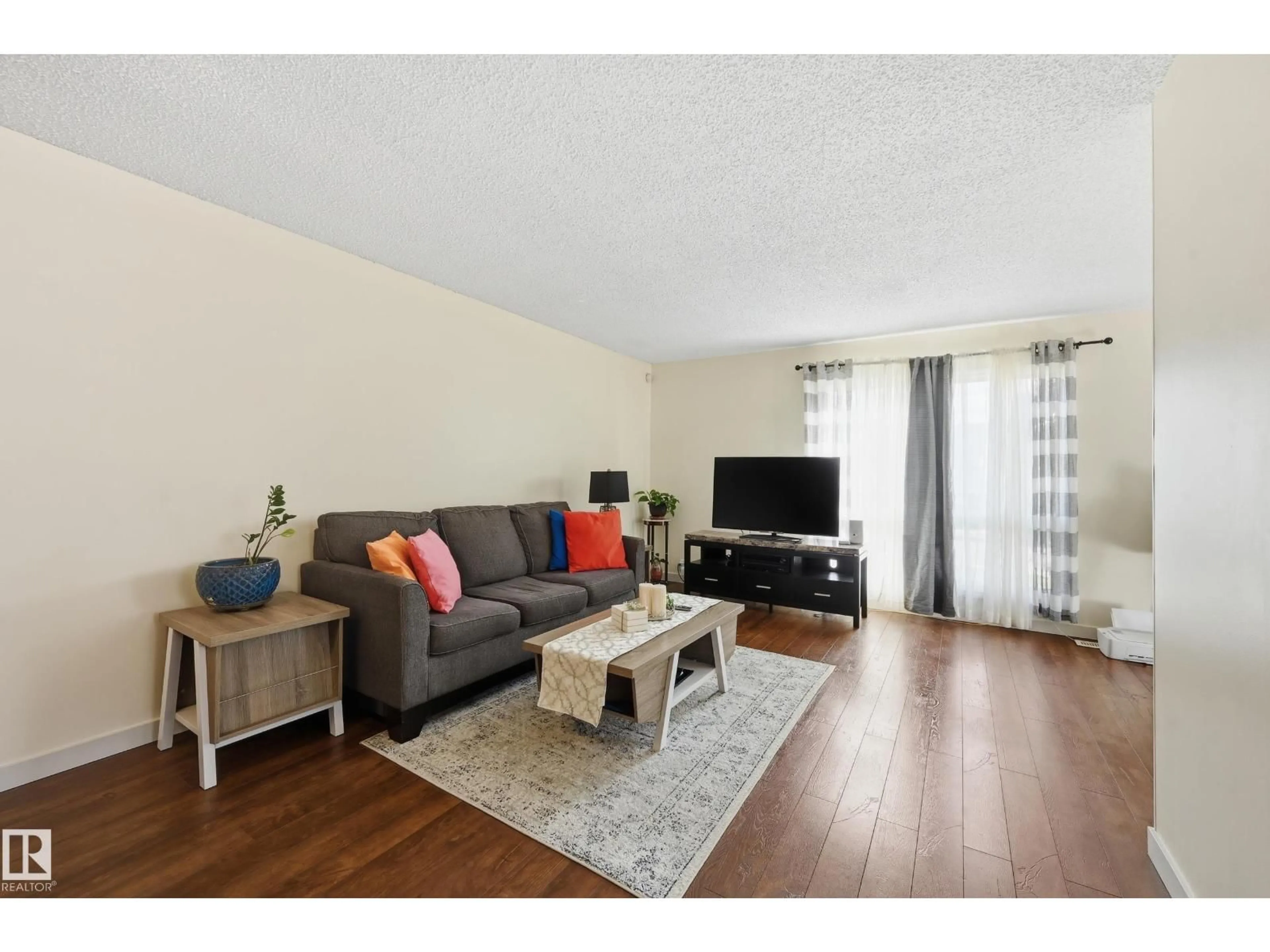 Living room with furniture, wood/laminate floor for 18424 96A AV, Edmonton Alberta T5T3N9
