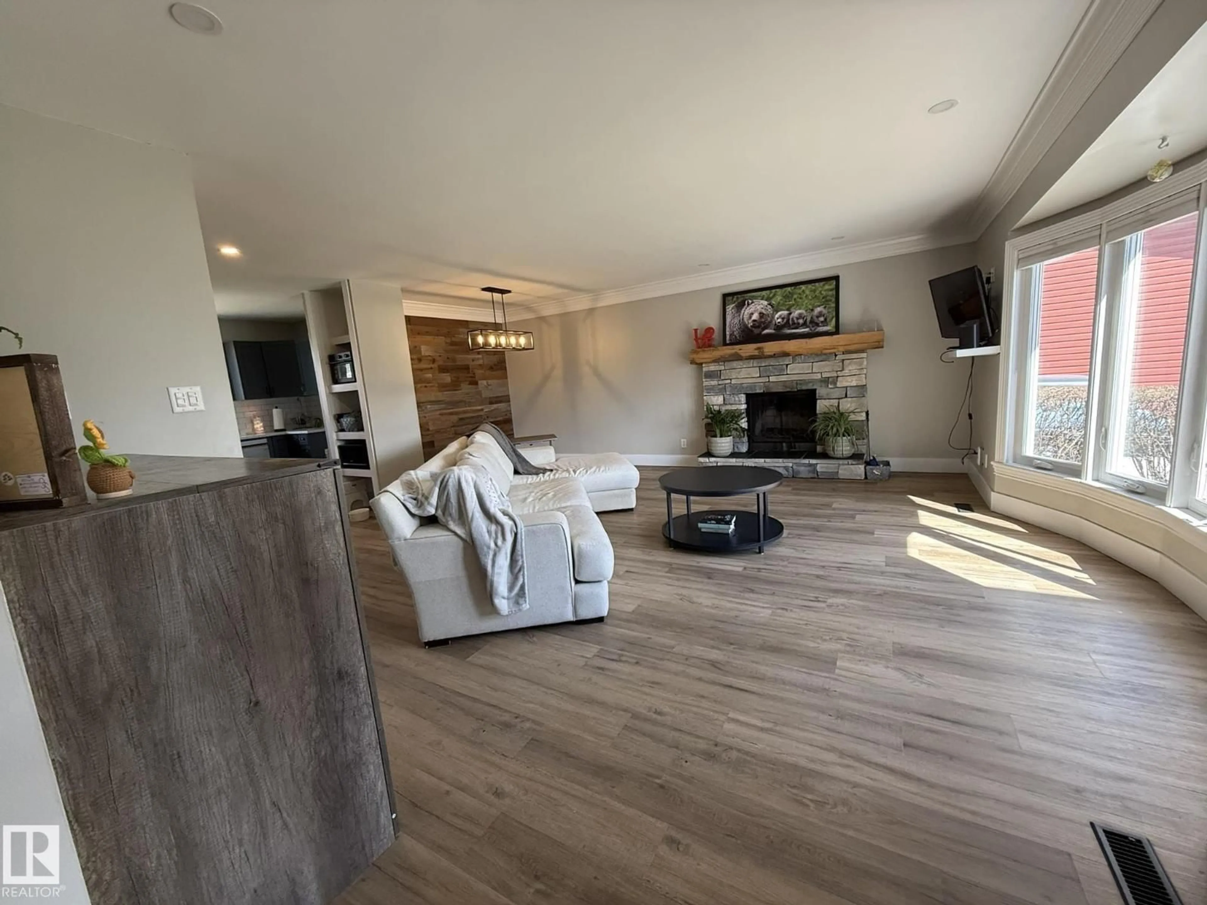 Living room with furniture, wood/laminate floor for 8004 180 ST, Edmonton Alberta T5T0T3
