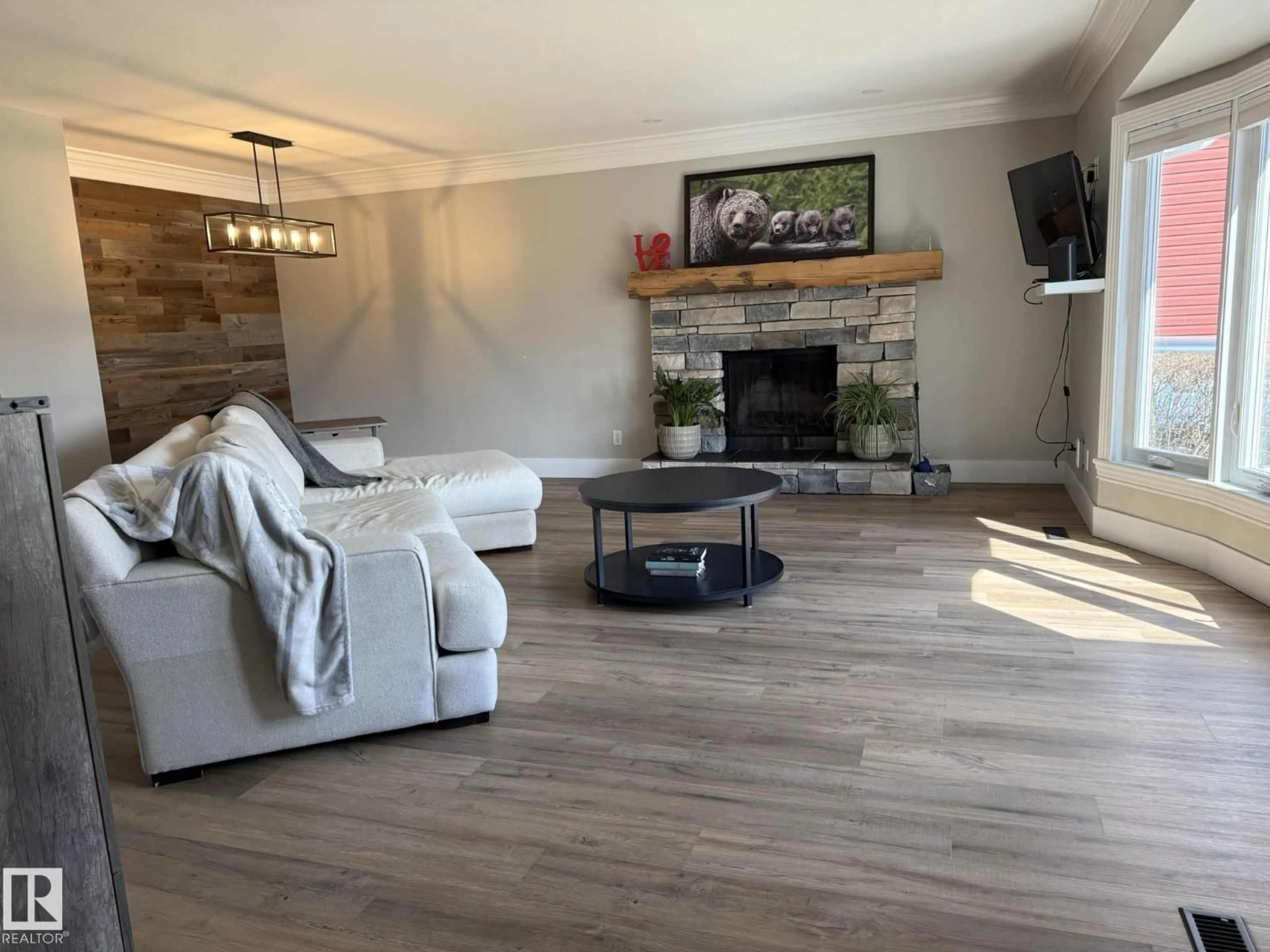 Living room with furniture, wood/laminate floor for 8004 180 ST, Edmonton Alberta T5T0T3