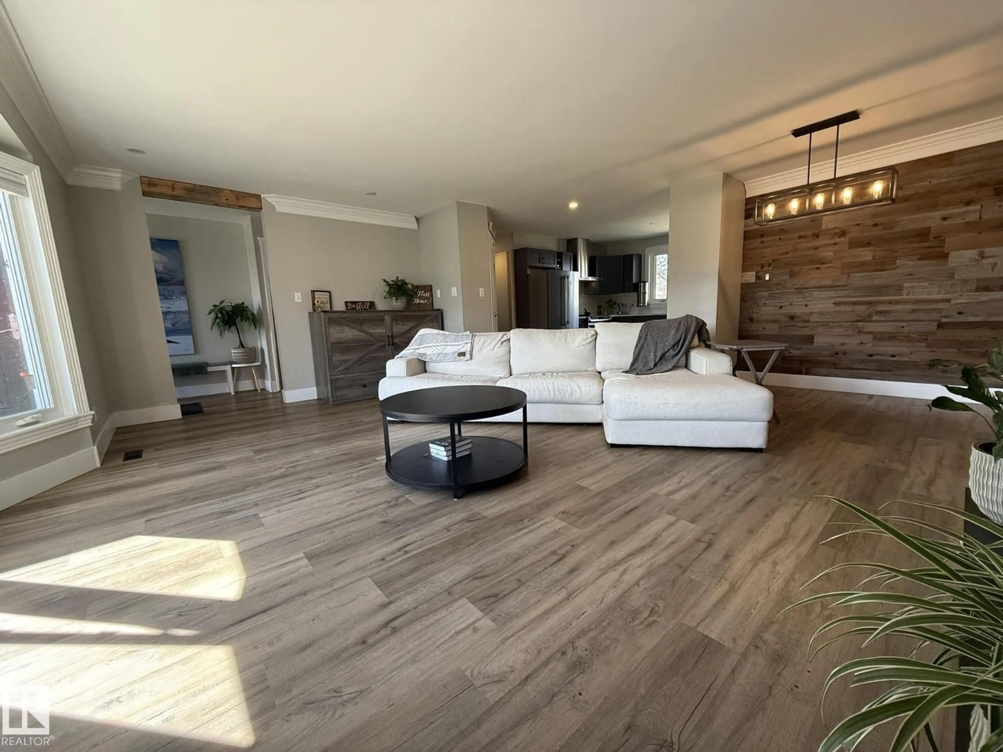 Living room with furniture, wood/laminate floor for 8004 180 ST, Edmonton Alberta T5T0T3