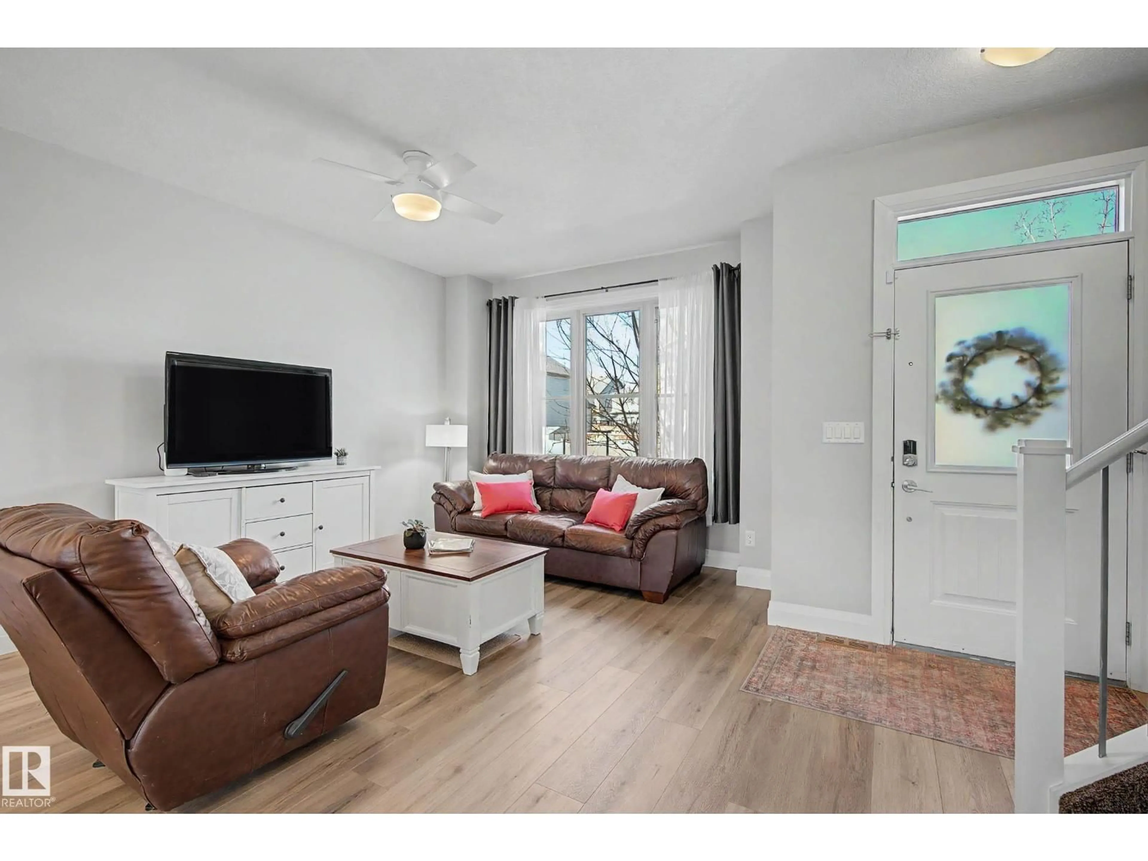 Living room with furniture, wood/laminate floor for 82 GILMORE WY, Spruce Grove Alberta T7X0M5