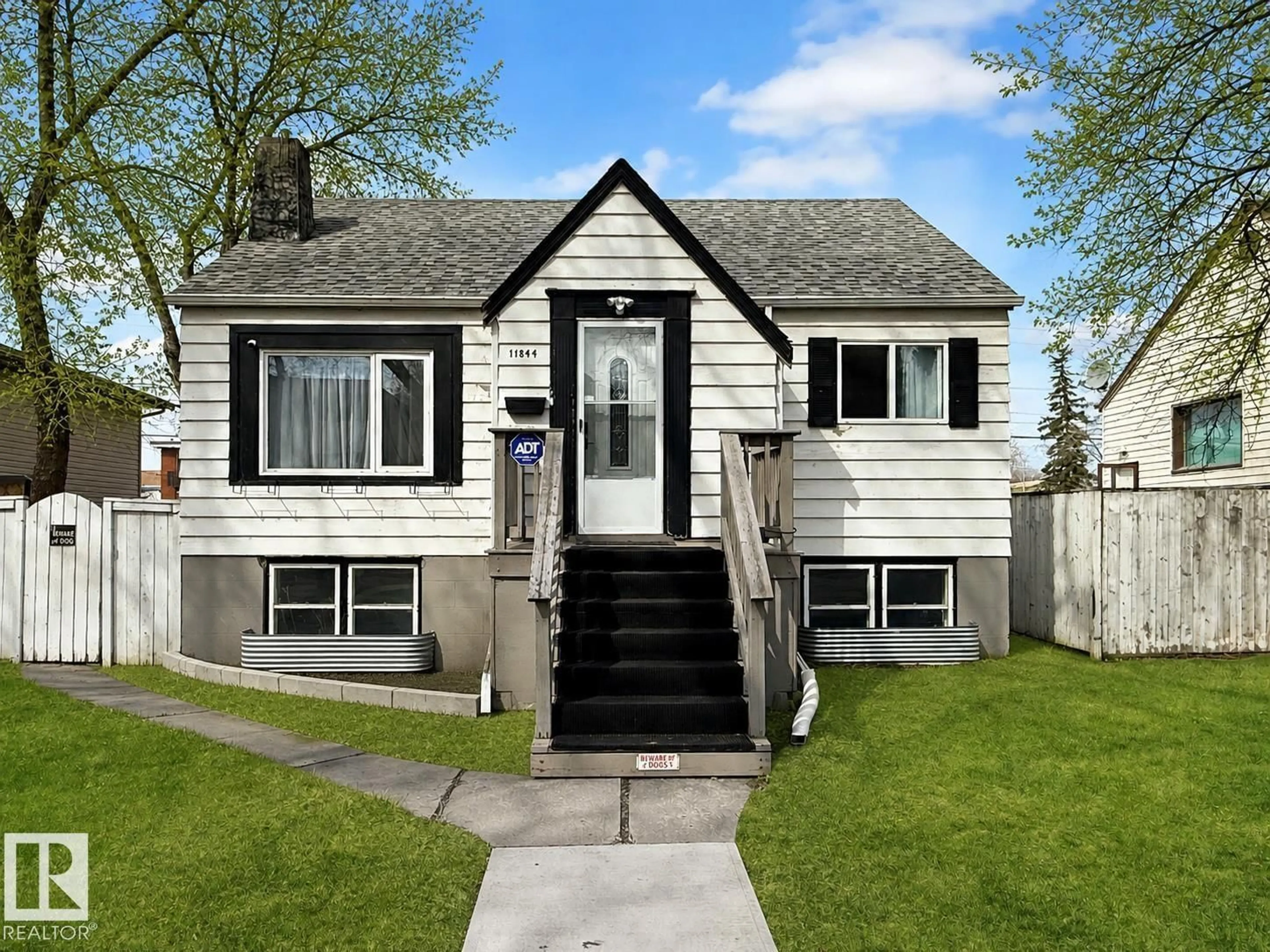 Home with vinyl exterior material, street for 11844 96 ST, Edmonton Alberta T5G1V3