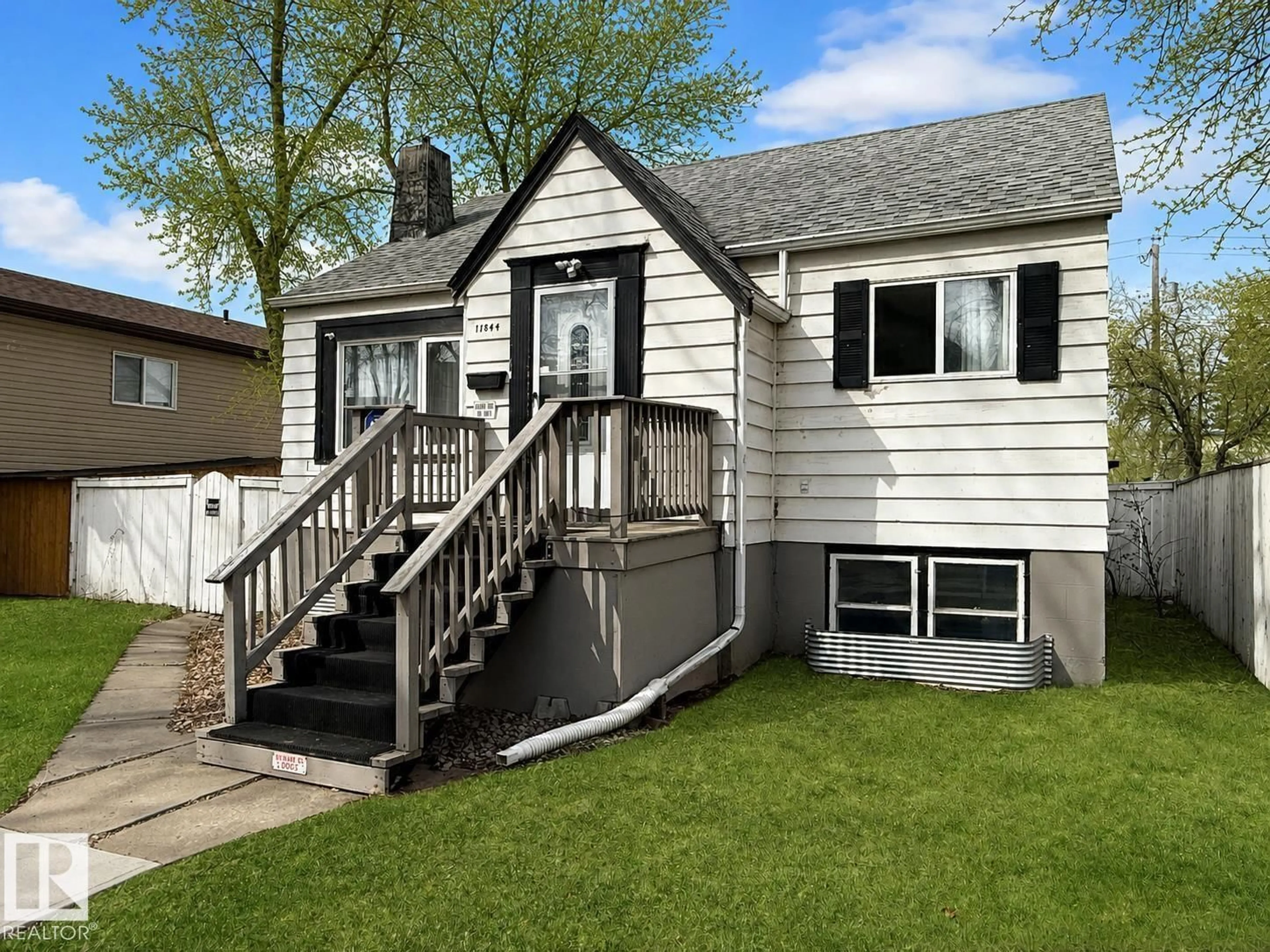 Home with vinyl exterior material, street for 11844 96 ST, Edmonton Alberta T5G1V3