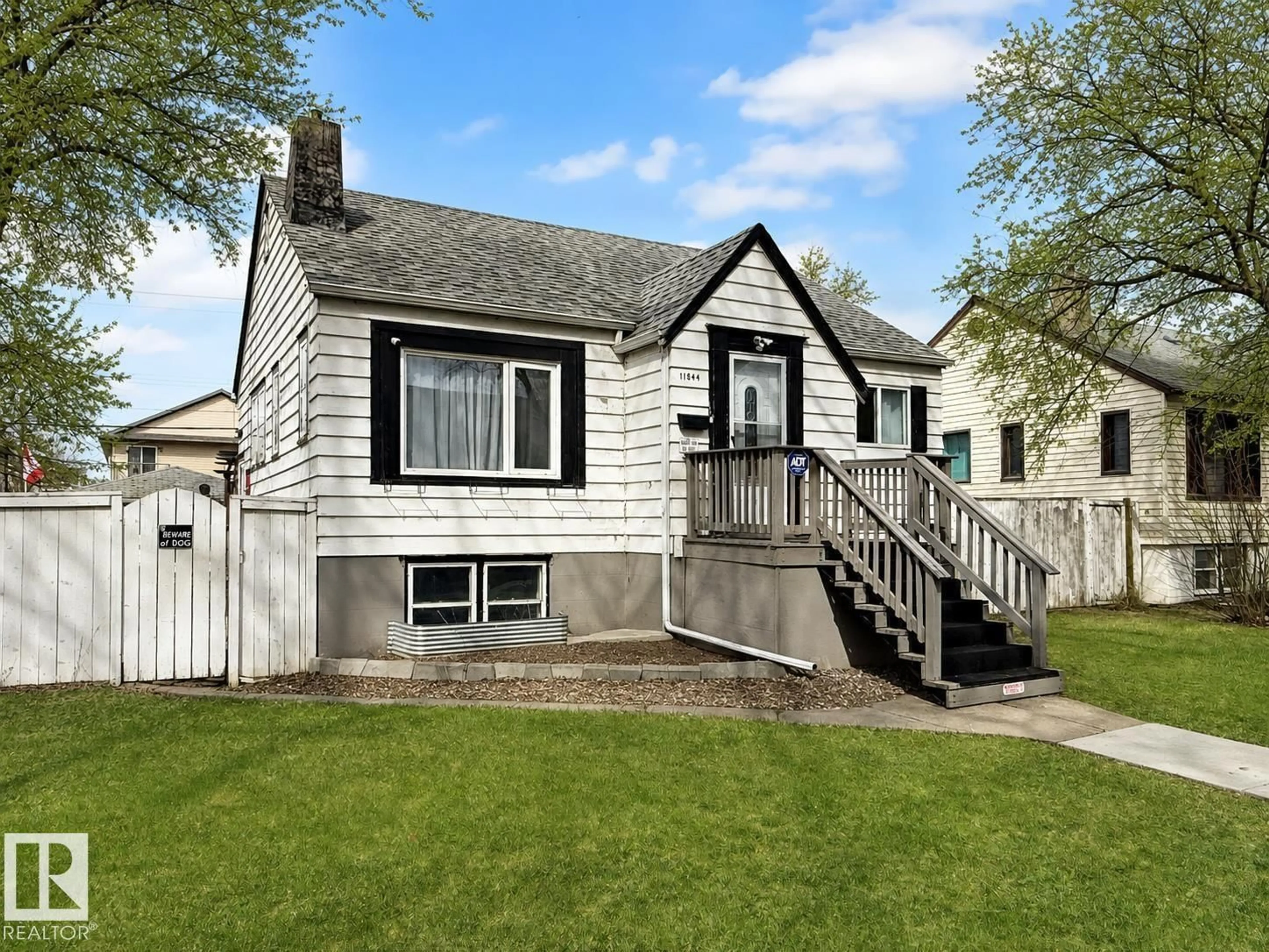 Home with vinyl exterior material, street for 11844 96 ST, Edmonton Alberta T5G1V3