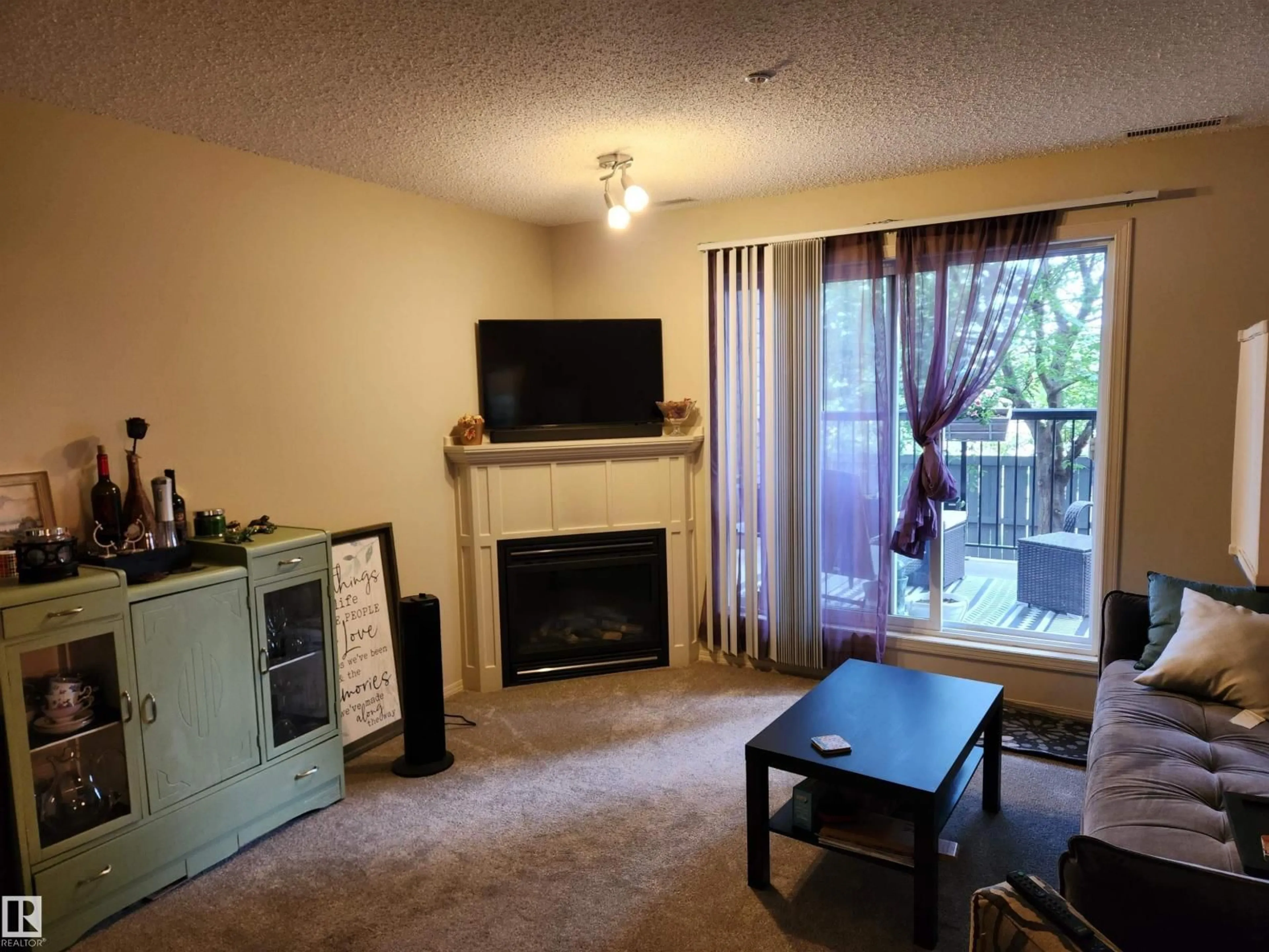 Living room with furniture, wood/laminate floor for #123 - 2098 BLACKMUD CREEK DR, Edmonton Alberta T6W1T7