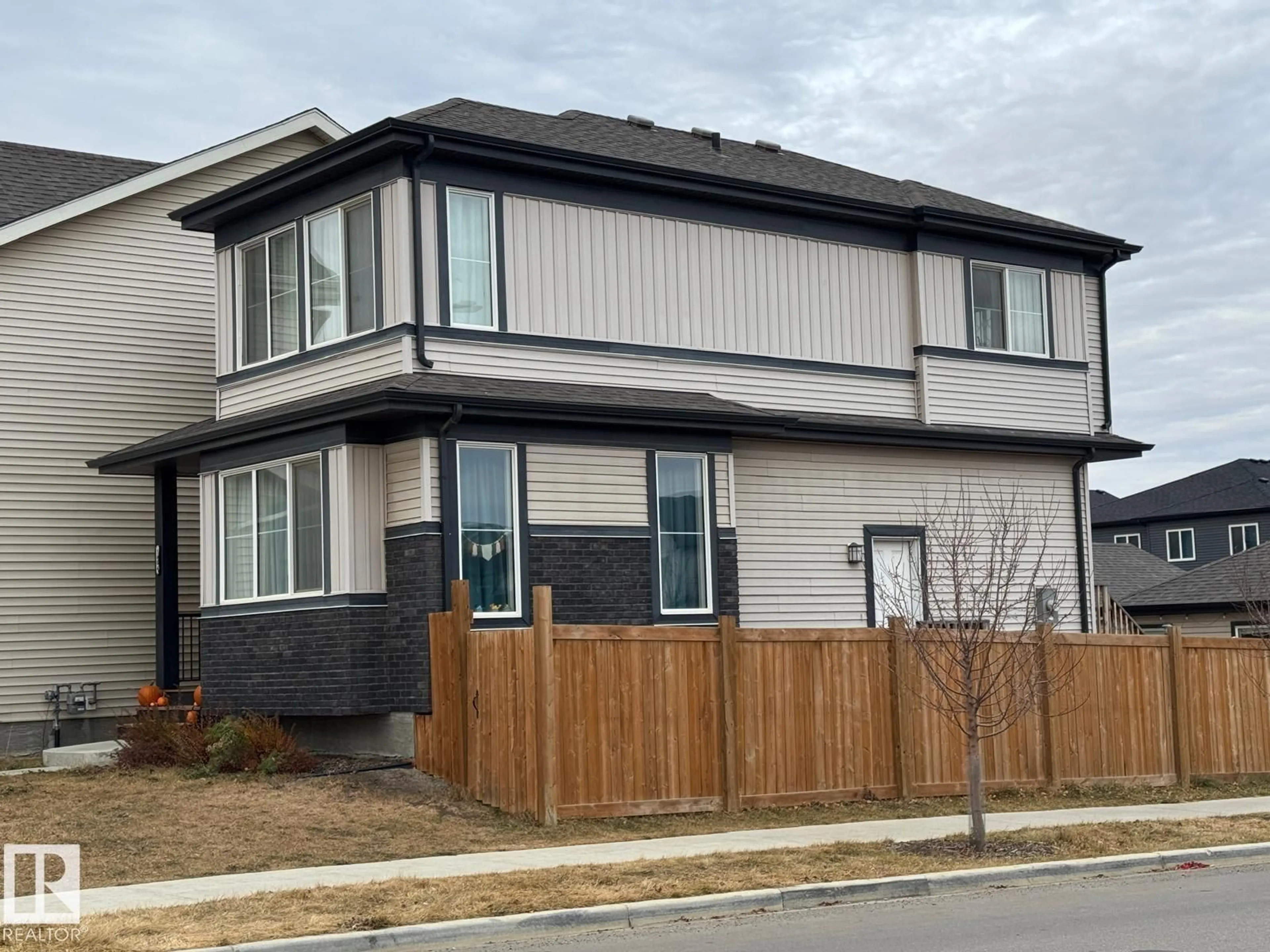 Home with vinyl exterior material, street for 1404 PODERSKY LI, Edmonton Alberta T6W4W4