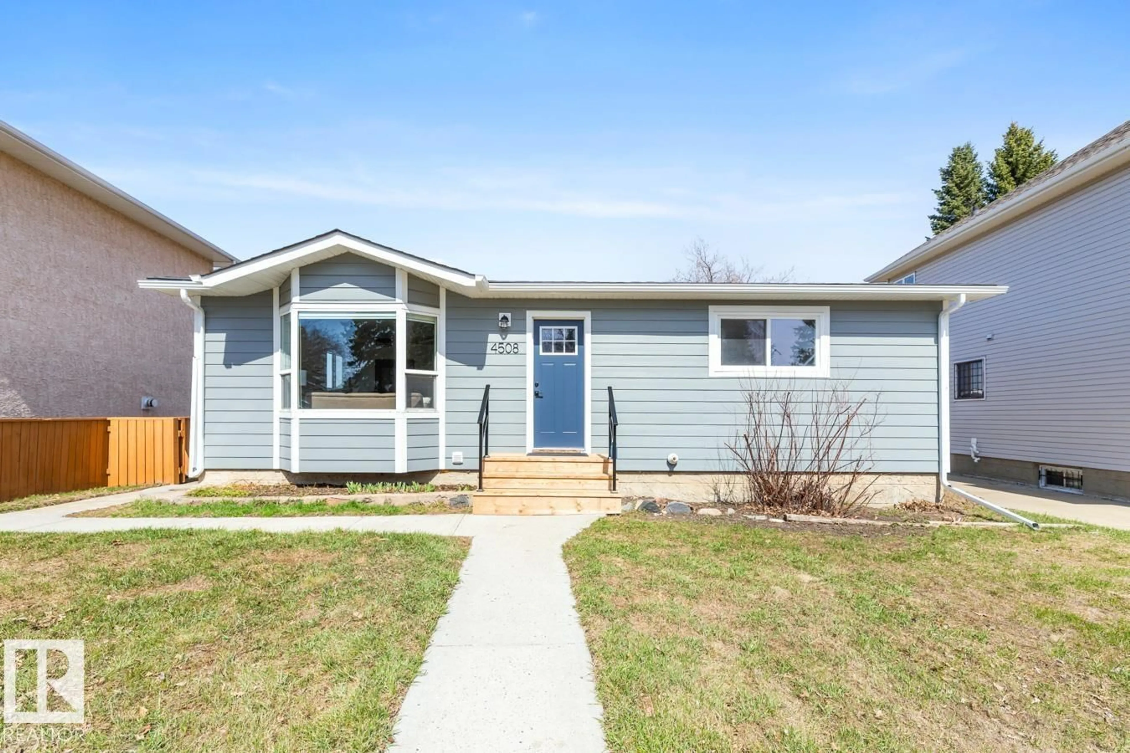 Home with vinyl exterior material, street for 4508 109A AV, Edmonton Alberta T6A1S4