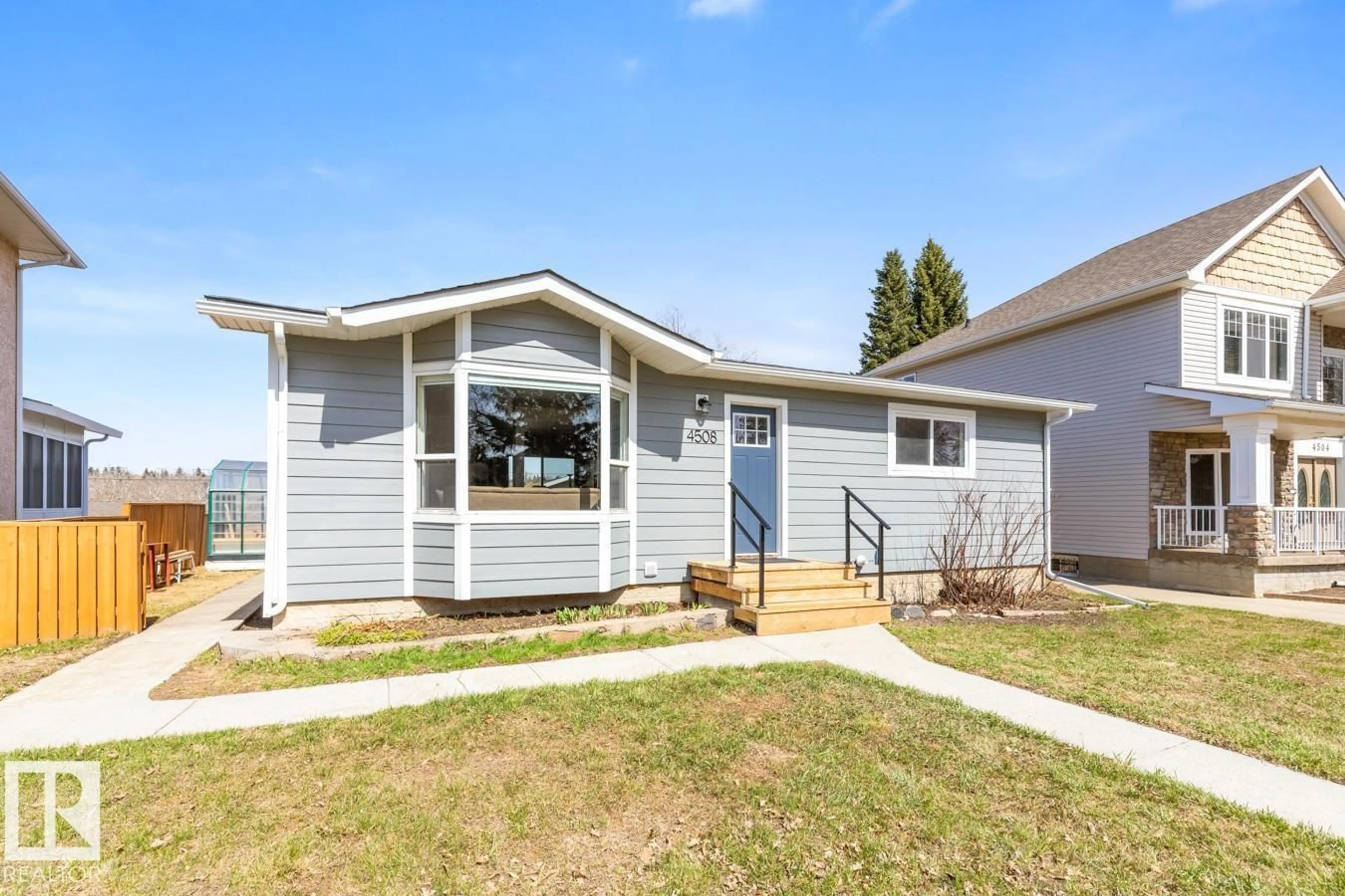 Home with vinyl exterior material, street for 4508 109A AV, Edmonton Alberta T6A1S4