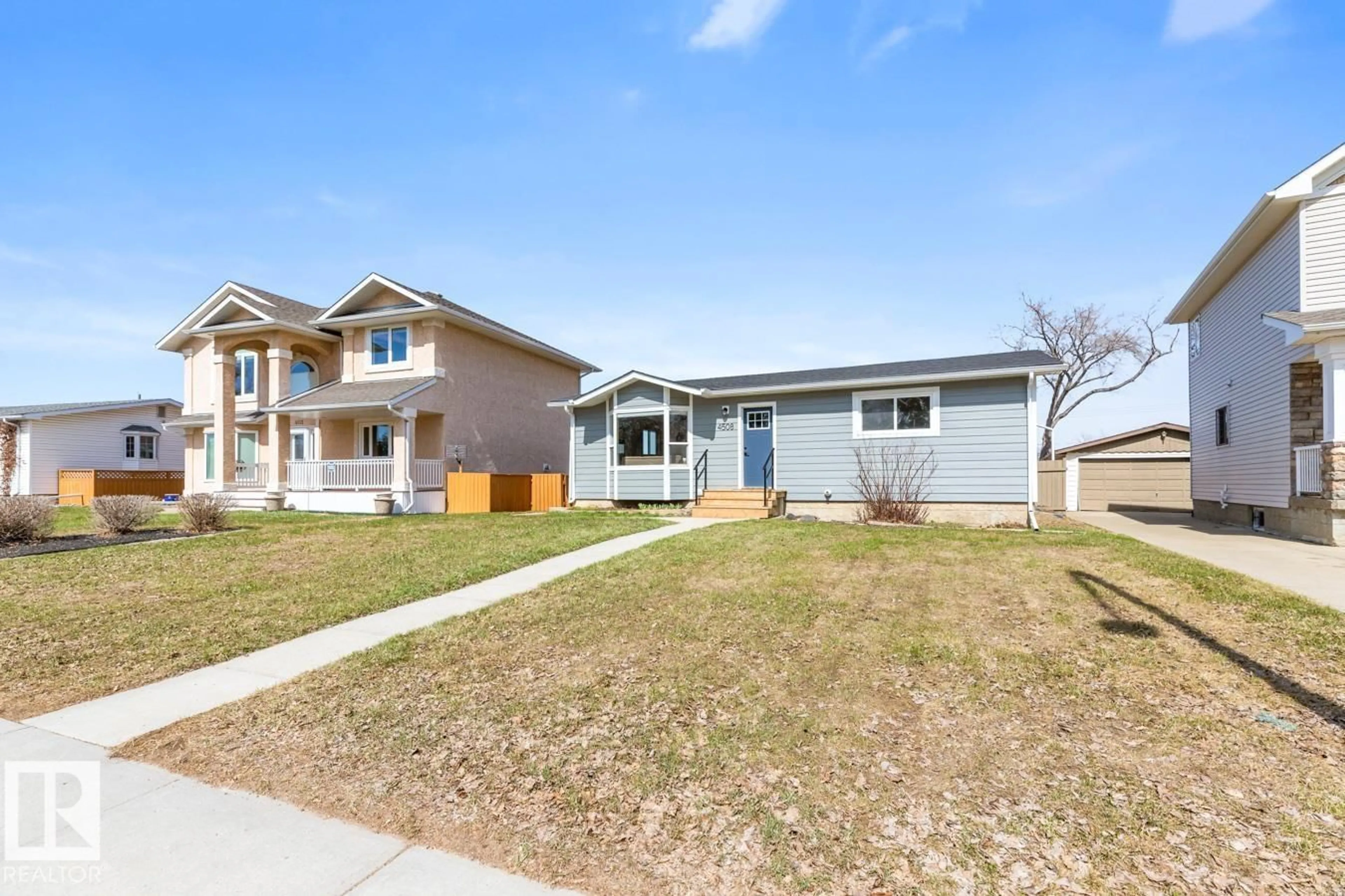 Home with vinyl exterior material, street for 4508 109A AV, Edmonton Alberta T6A1S4
