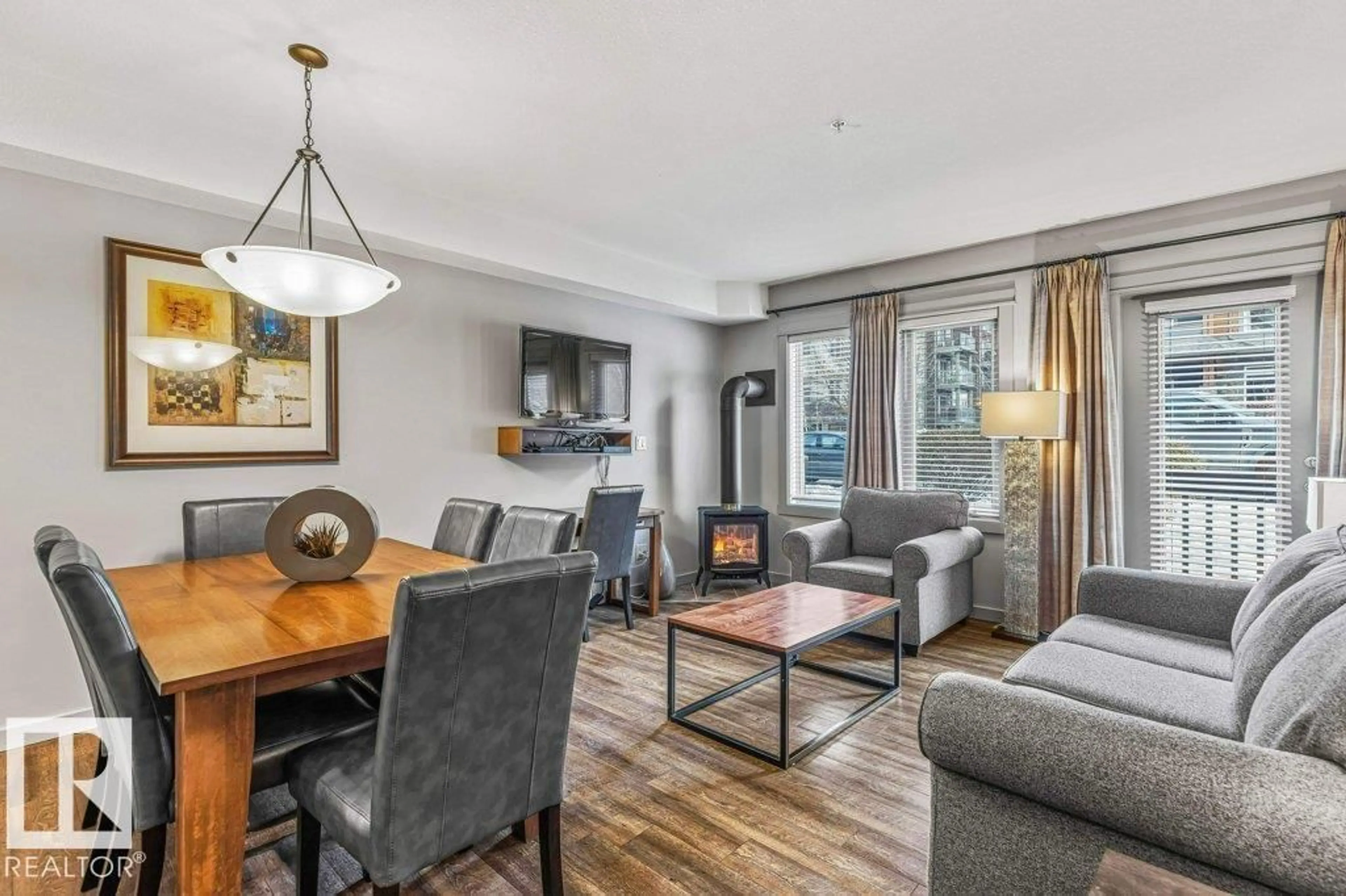 Living room with furniture, wood/laminate floor for 109 - 114 MONTANE RD, Canmore Alberta T1W3J2