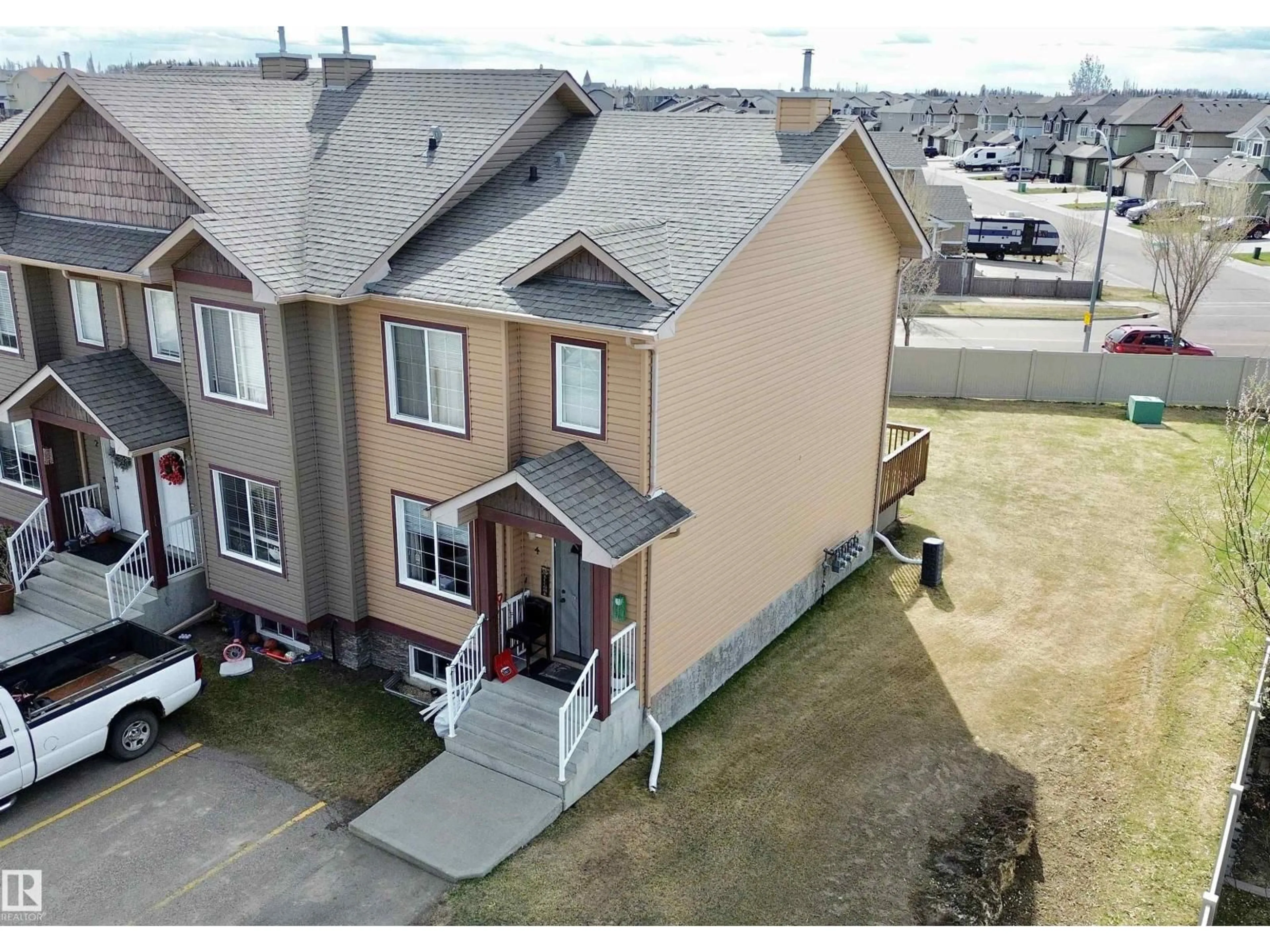 A pic from outside/outdoor area/front of a property/back of a property/a pic from drone, unknown for #4 - 320 SPRUCE RIDGE RD, Spruce Grove Alberta T7X0H5