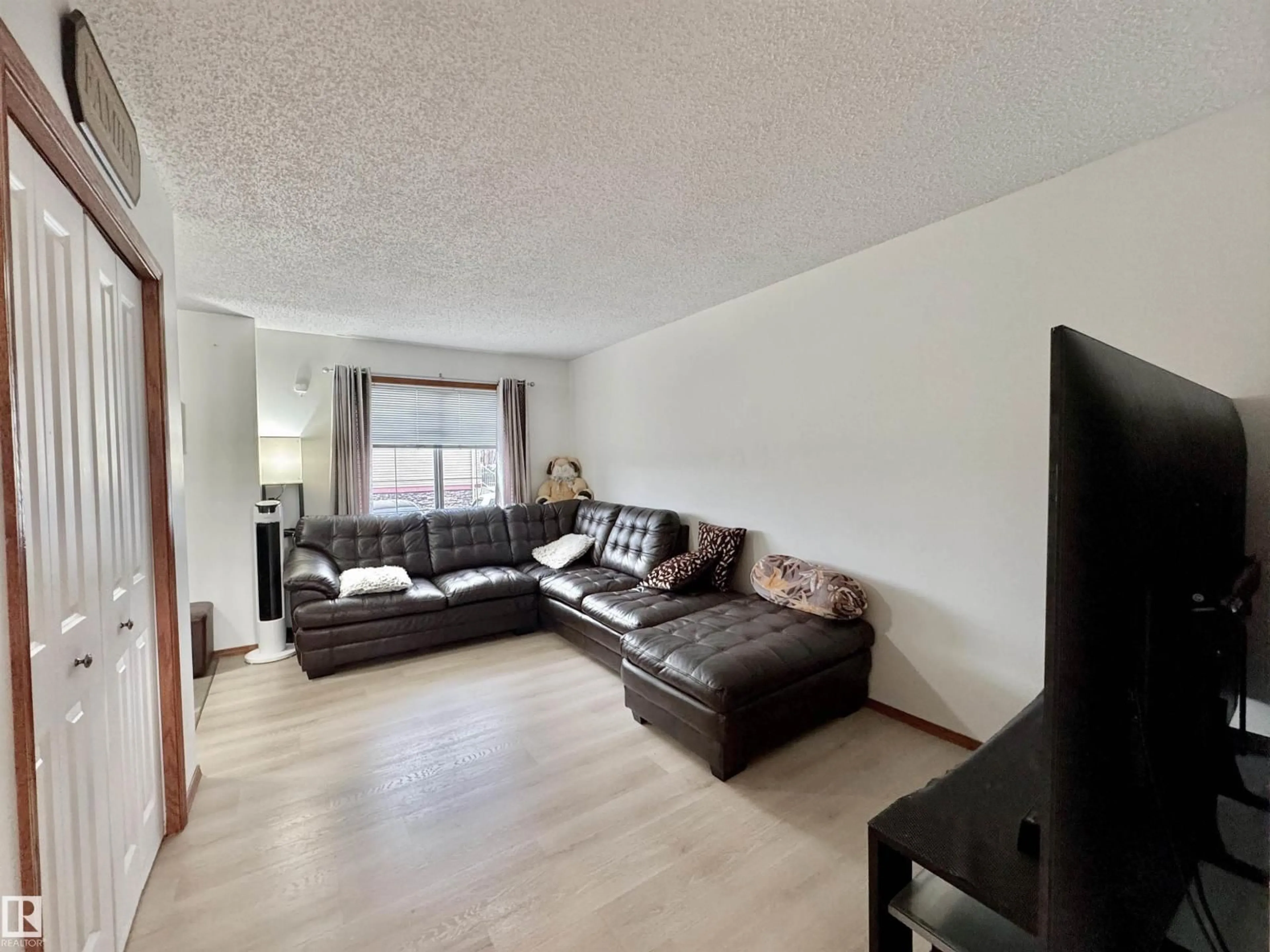 Living room with furniture, wood/laminate floor for #4 - 320 SPRUCE RIDGE RD, Spruce Grove Alberta T7X0H5