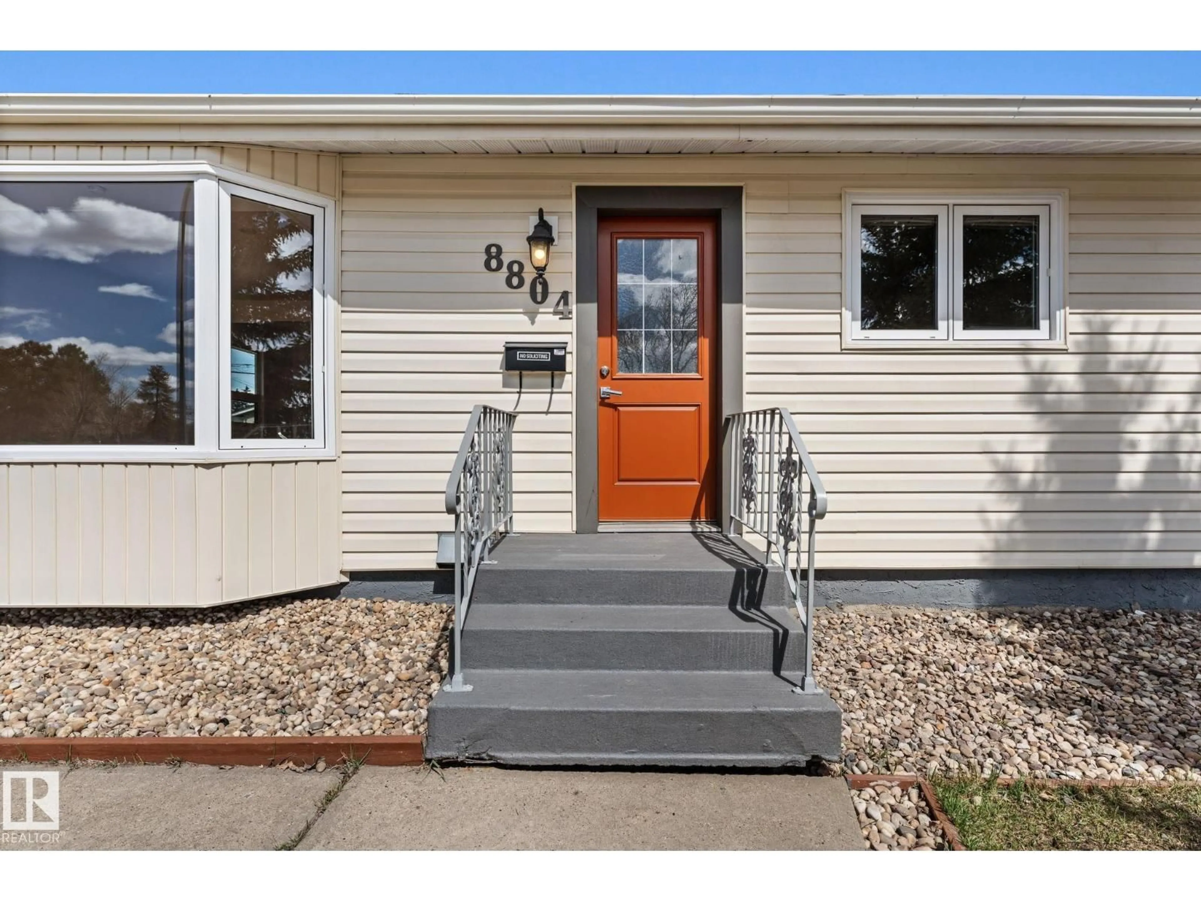 Home with vinyl exterior material, street for 8804 135 AV, Edmonton Alberta T5E1N3